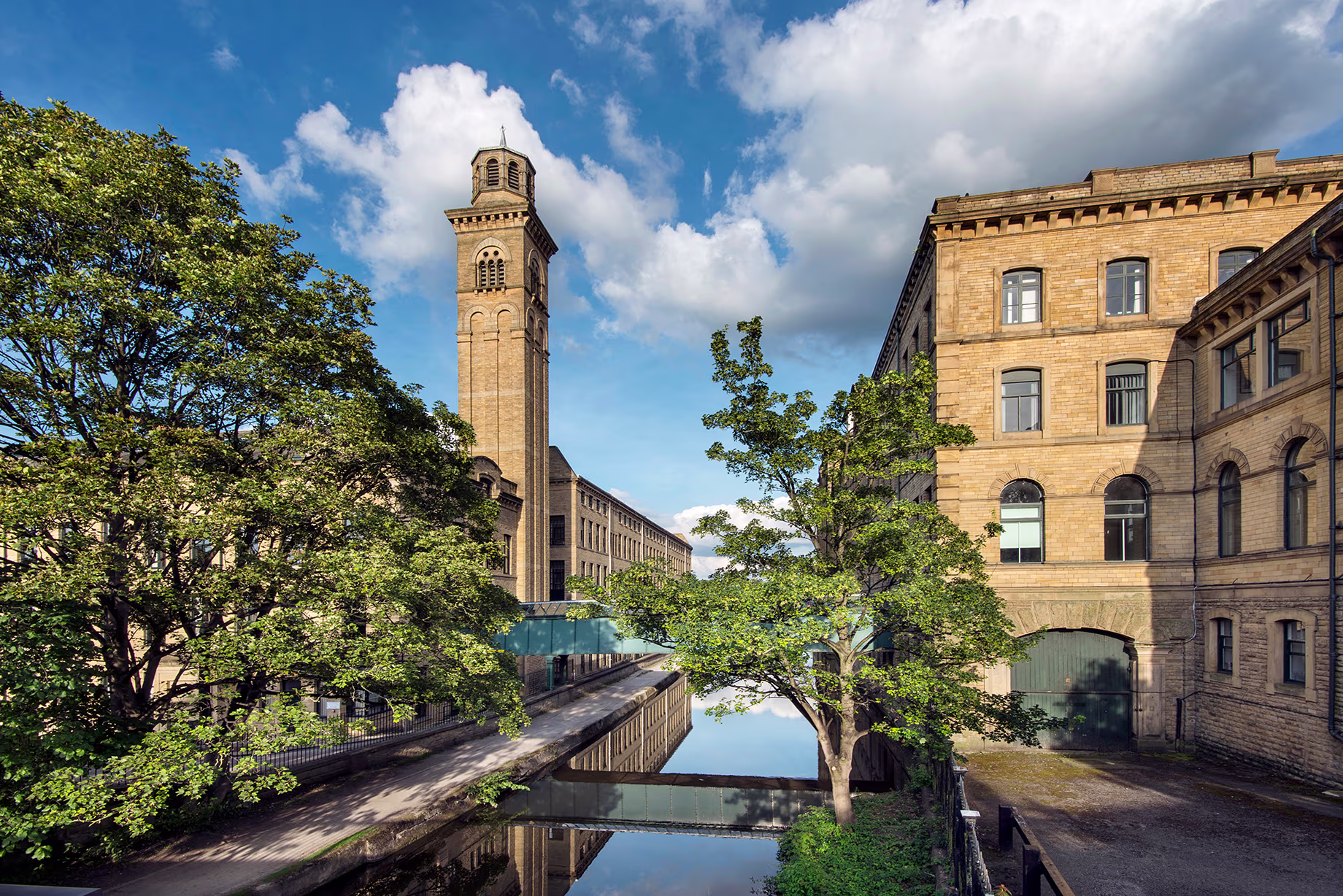 Scenic view of historic English buildings along a peaceful river