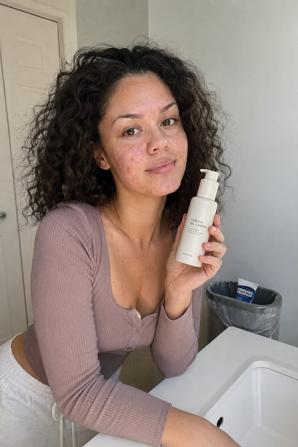 Minimalist skincare products arranged on a warm ivory surface — representing a 30-day niacinamide reset journey
