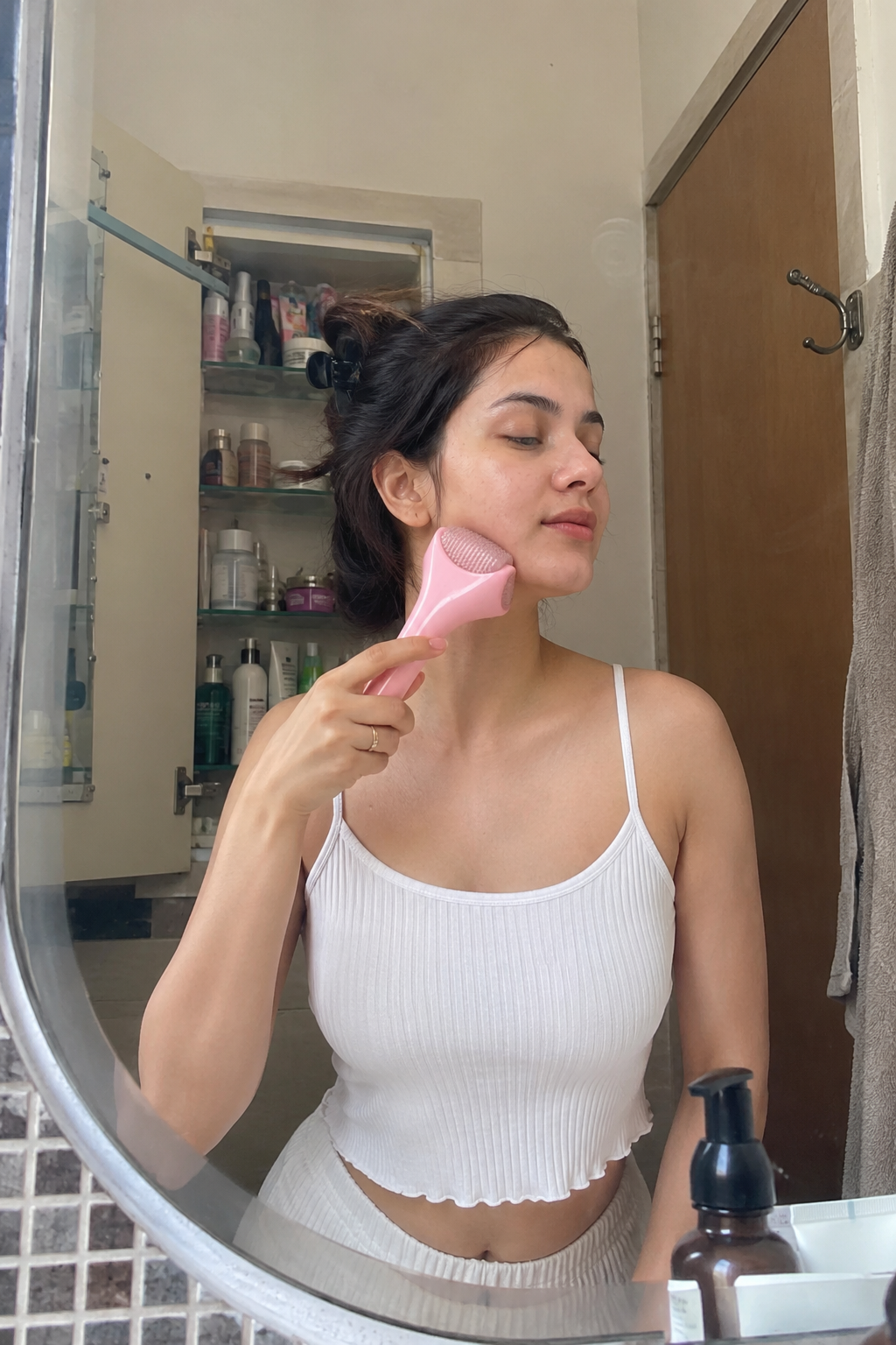 Skincare flatlay with collagen powder and minimal products on marble surface