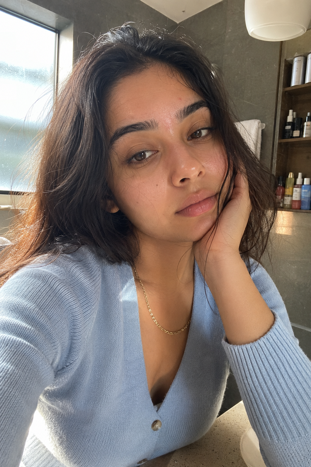 Woman with clear glowing skin in warm natural light — collagen routine results