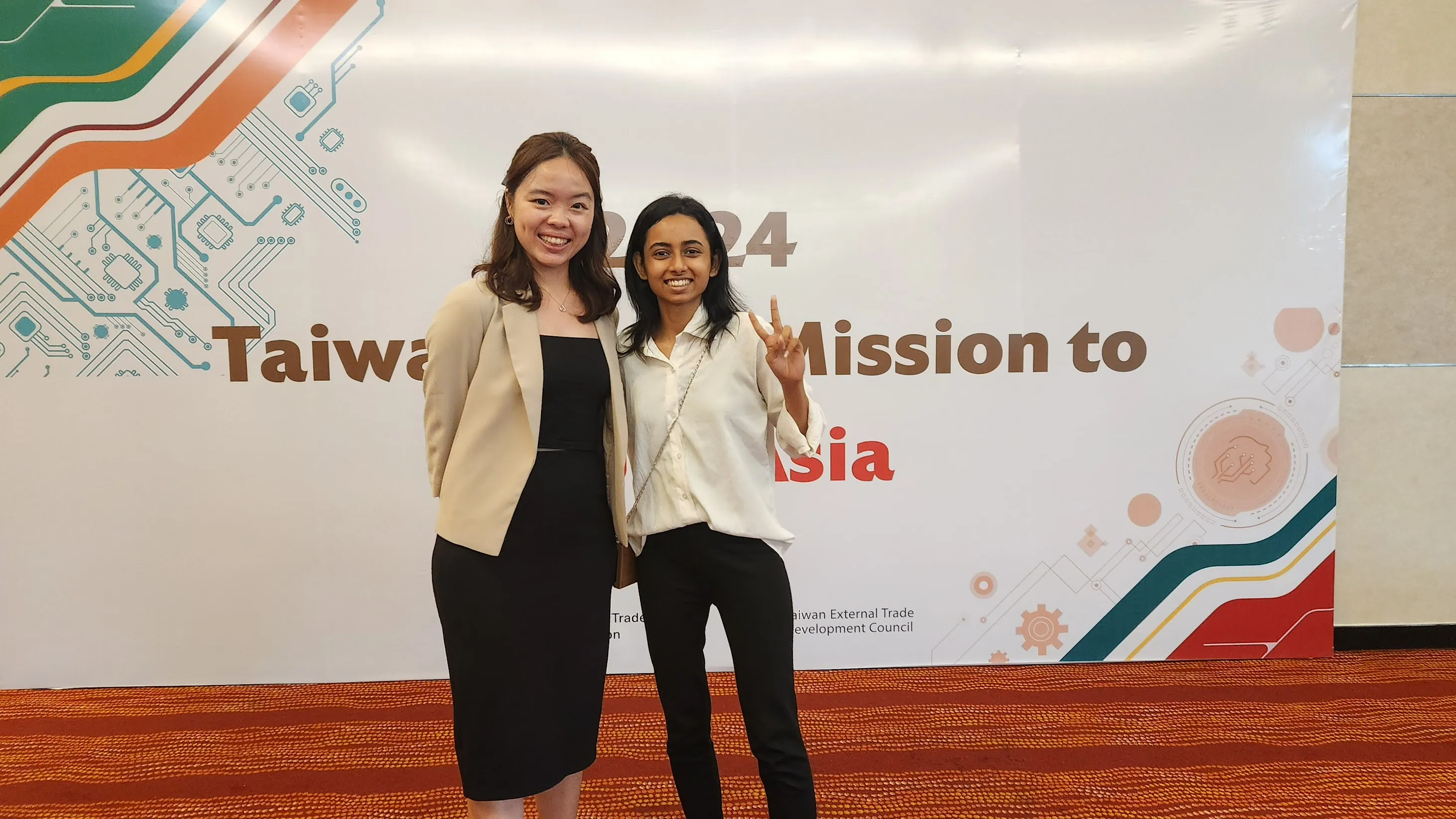 Coolpanda guests in front of an event backdrop