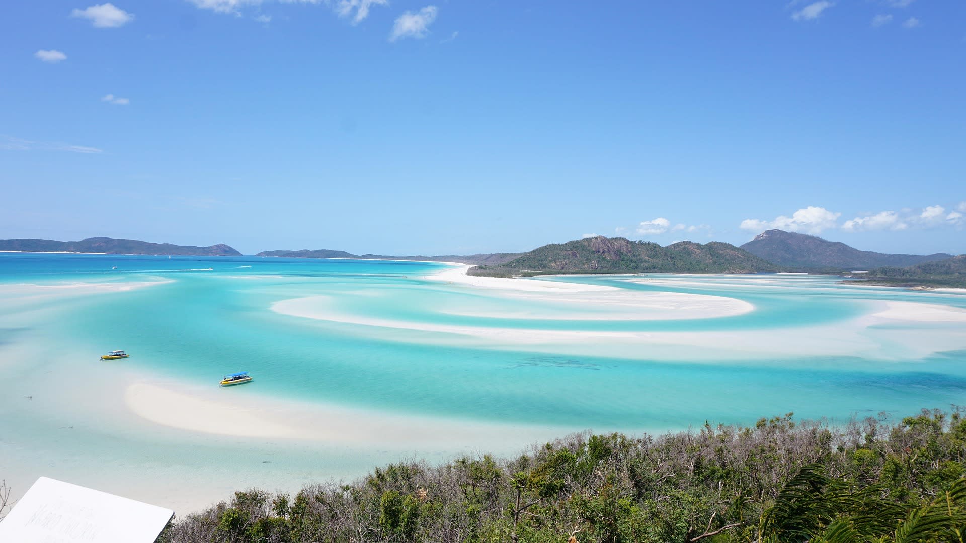 Aerial view of Whitehaven Beach white silica sand swirls and turquoise water in the Whitsundays