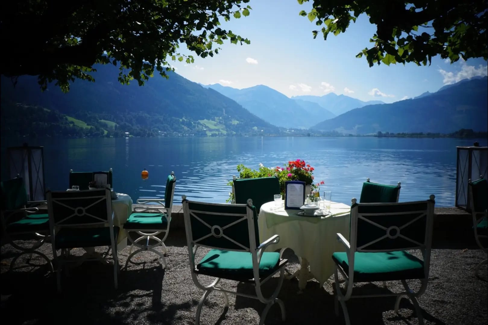 Terrace with a large lake in front and mountains with vegetation, Zell am See