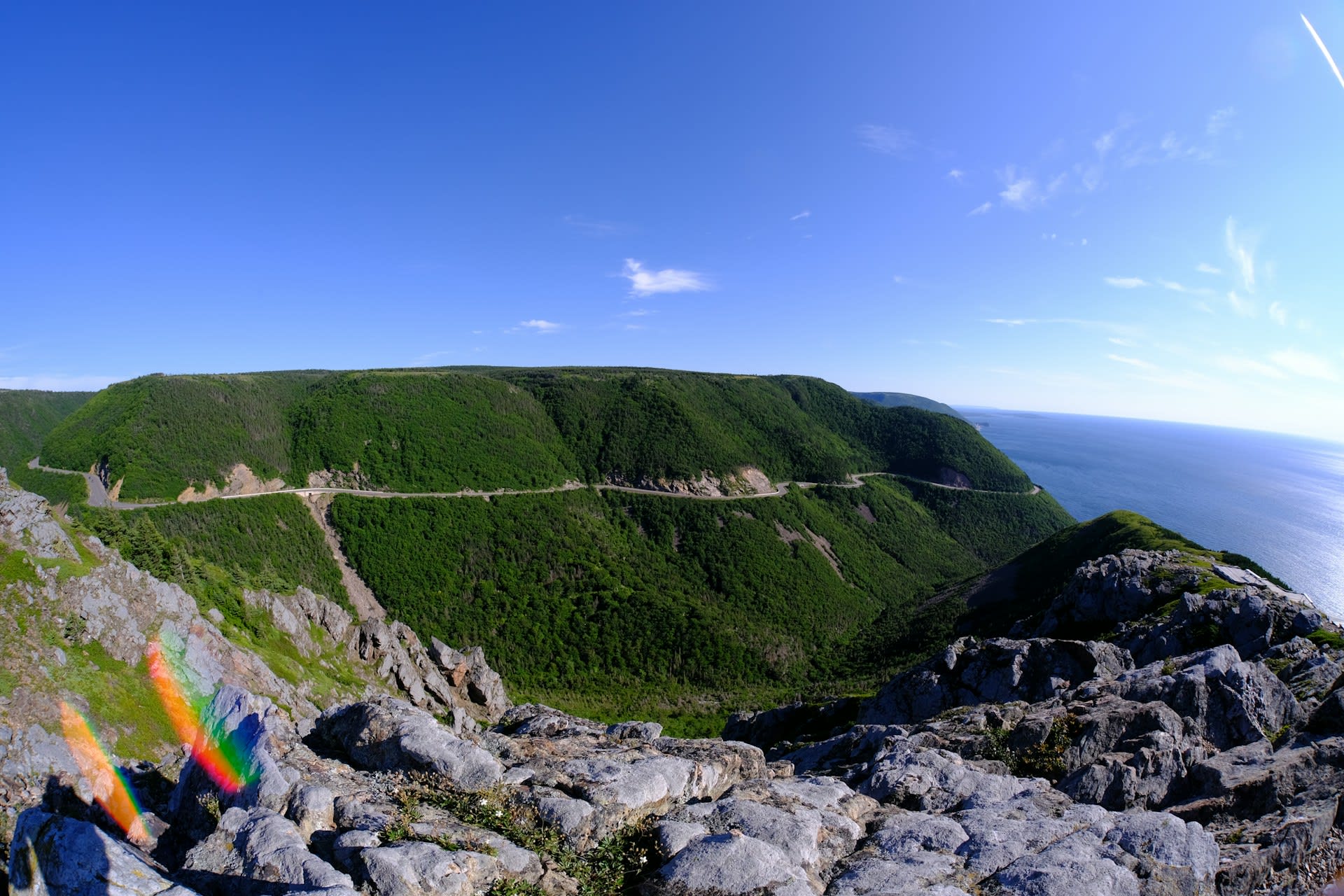 Cabot Trail winding along the dramatic coastal cliffs of Cape Breton Highlands with the Gulf of St Lawrence below