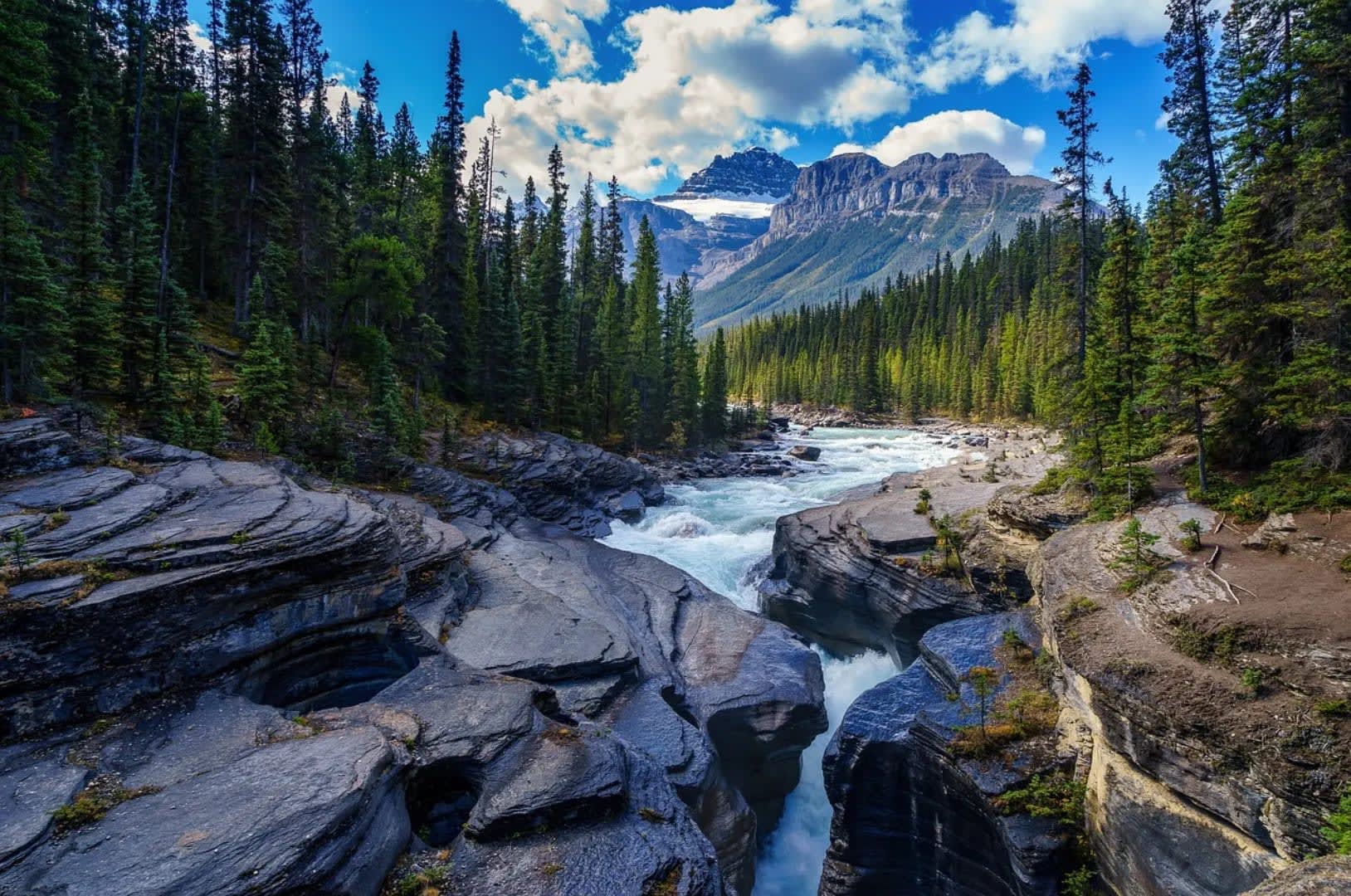 Mountain peaks at sunset, surrounded by wooded hills. Serra dos Órgãos National Park