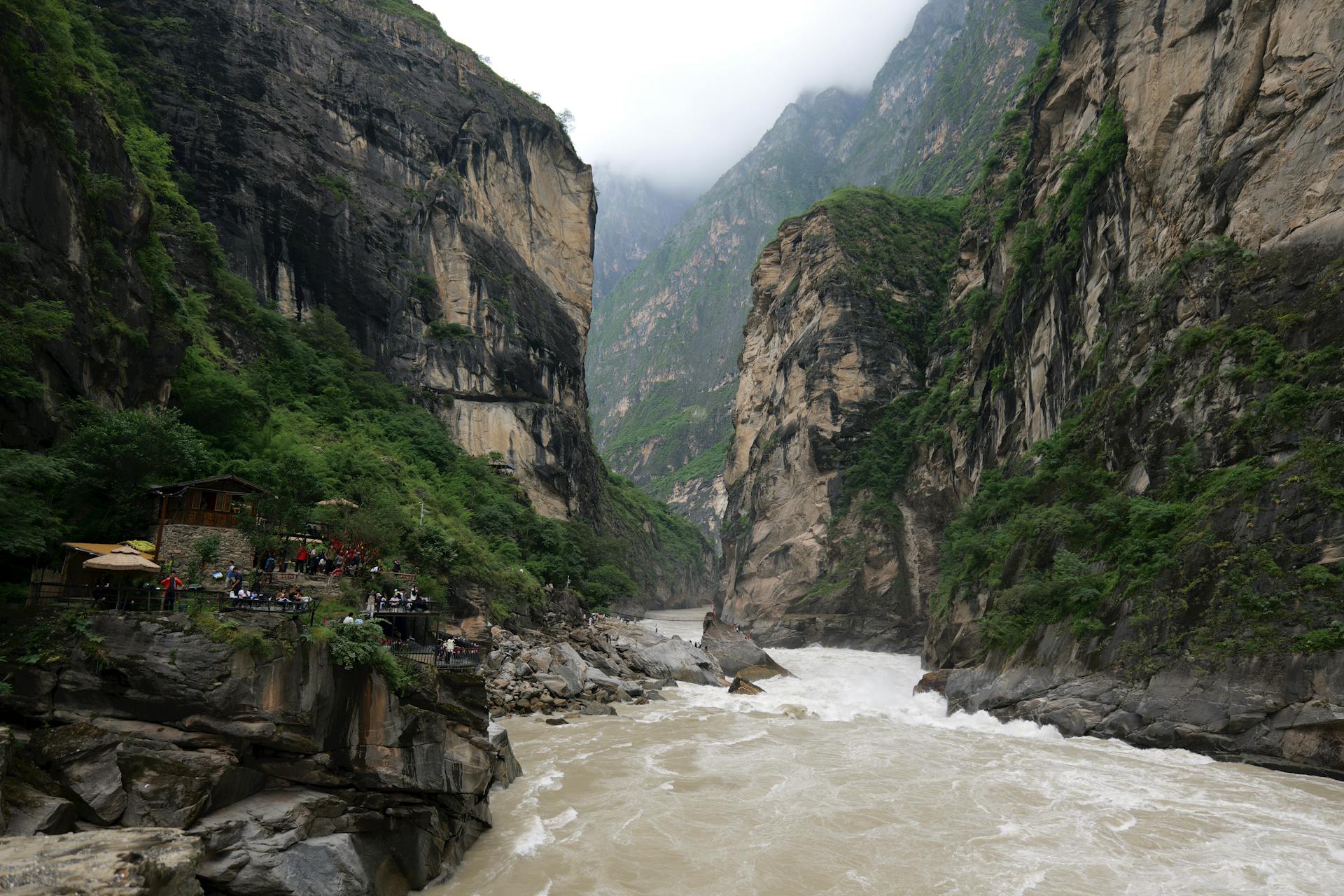 mountains with vegetation and a blue sky with white clouds, Hutiao-Xia