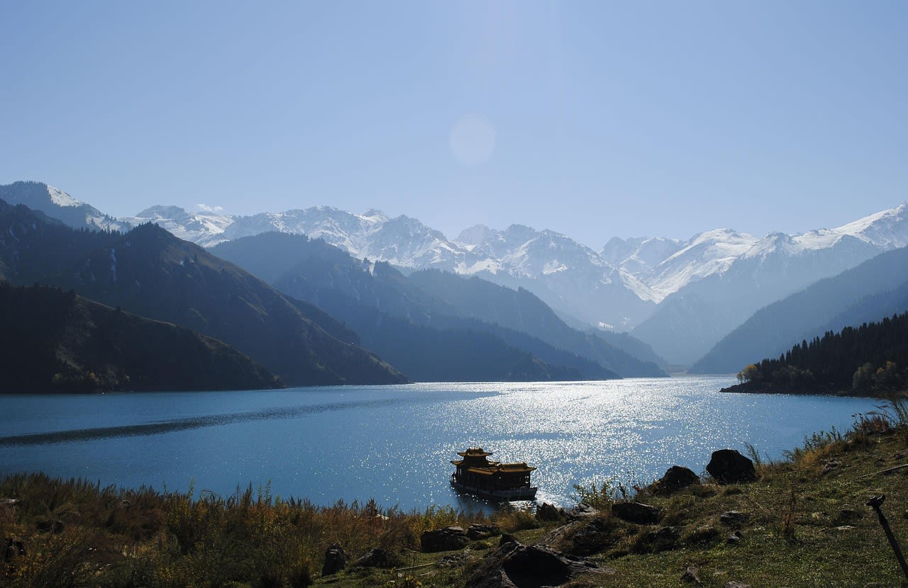 Tianchi Heaven Lake volcanic crater with deep blue water and snow-covered caldera rim on Changbai Mountain
