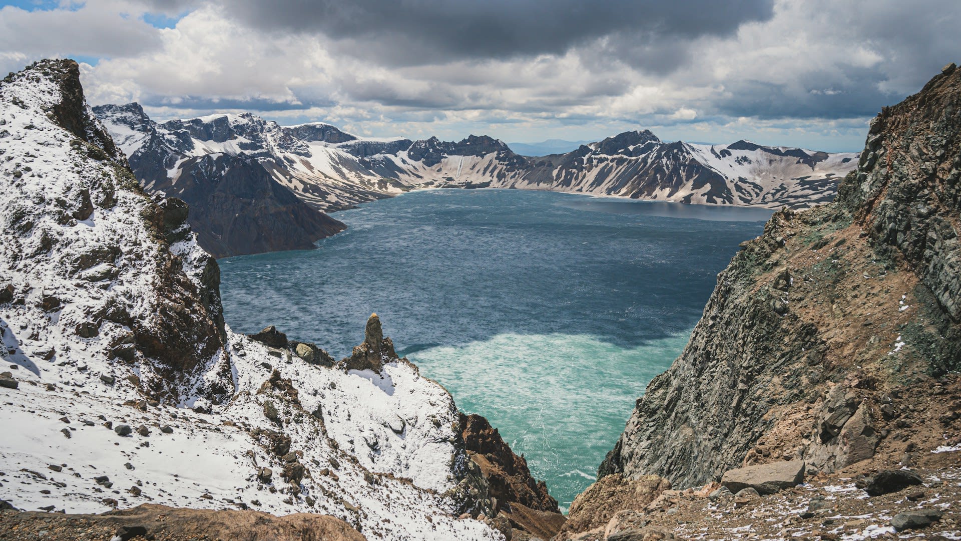 Changbai Waterfall cascading down the caldera wall from Tianchi Lake in autumn colours China