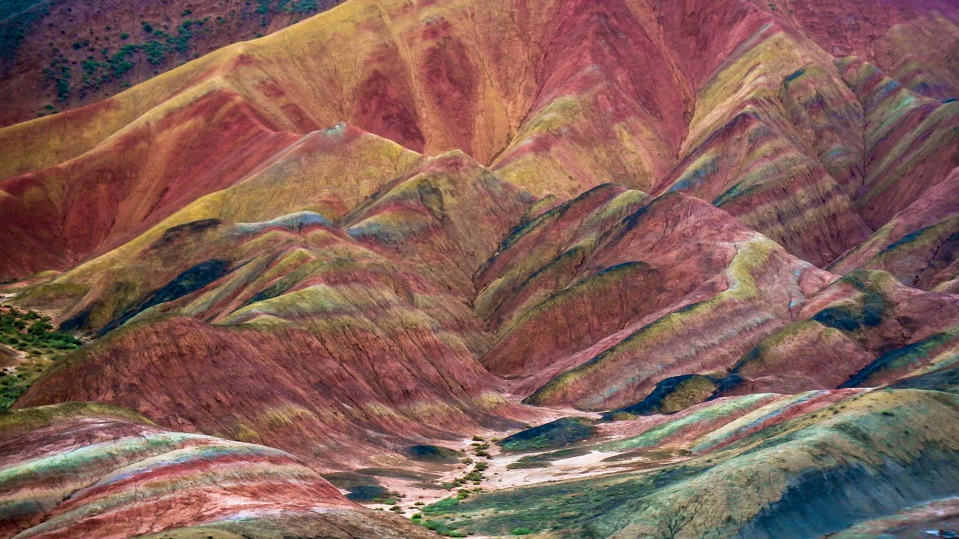 Soil hills in red, orange, brown, black, and white colors, Zhangye Danxia Landform