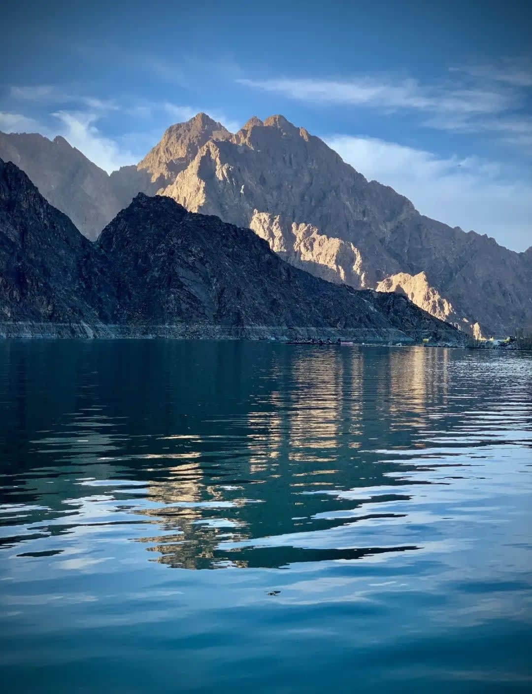 Lake in front of rocky, dry mountains, Jibal Hatta