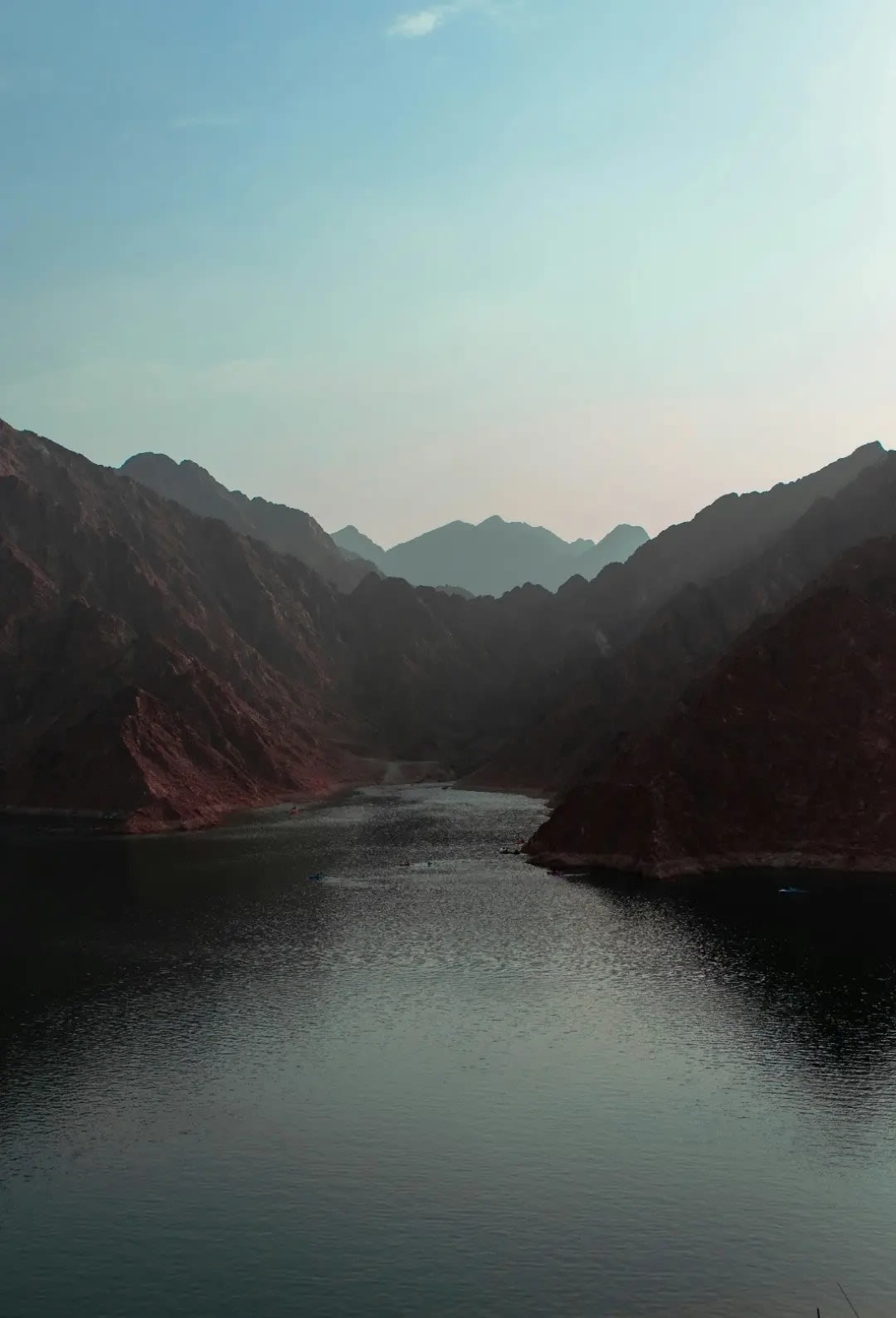 Lake in front of rocky, dry mountains, Jibal Hatta