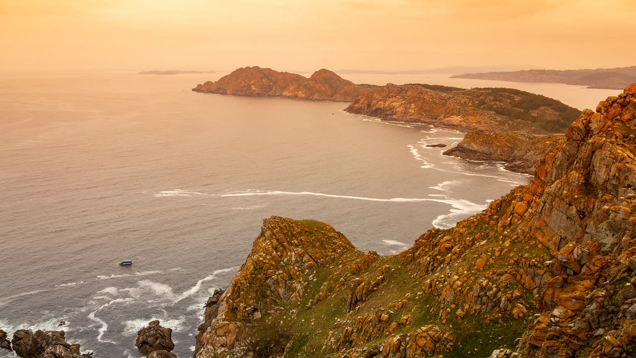 Rocky Atlantic coastline of the outer Cíes Islands with waves and cormorant nesting colonies