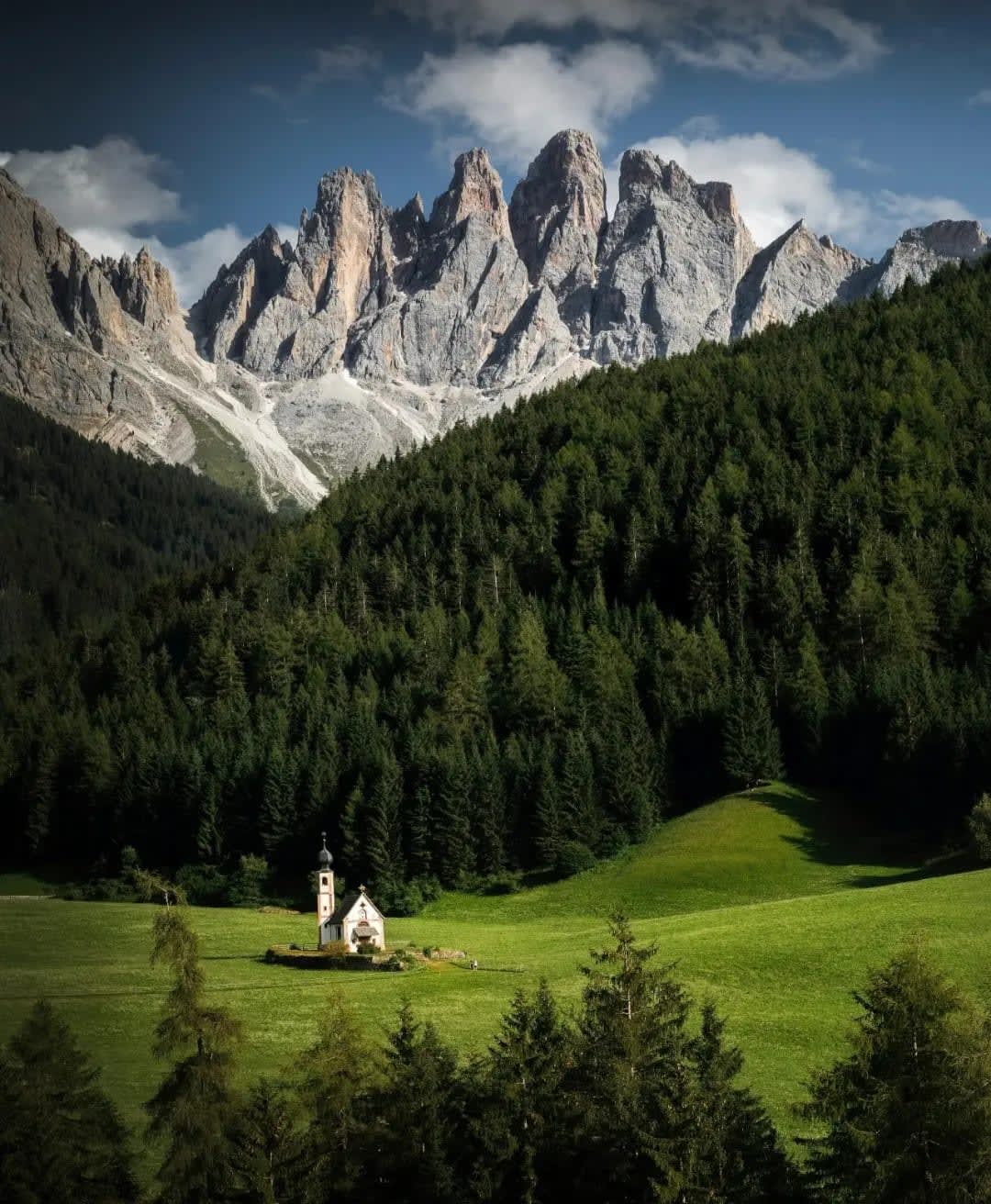 church in a meadow with a forest and mountains in the background, Picos de Europa