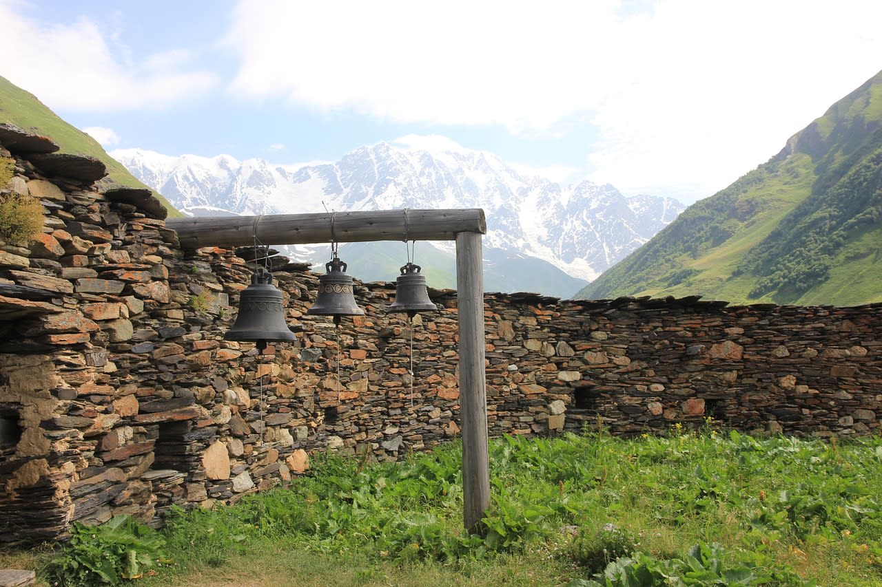 Svan watchtowers rising above the forested gorge of the Inguri river valley in upper Svaneti