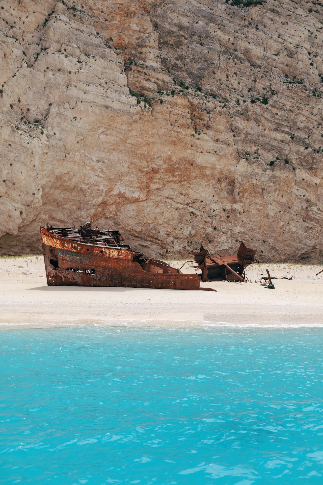 View from the clifftop platform above Navagio Beach looking down at the enclosed cove and shipwreck Zakynthos