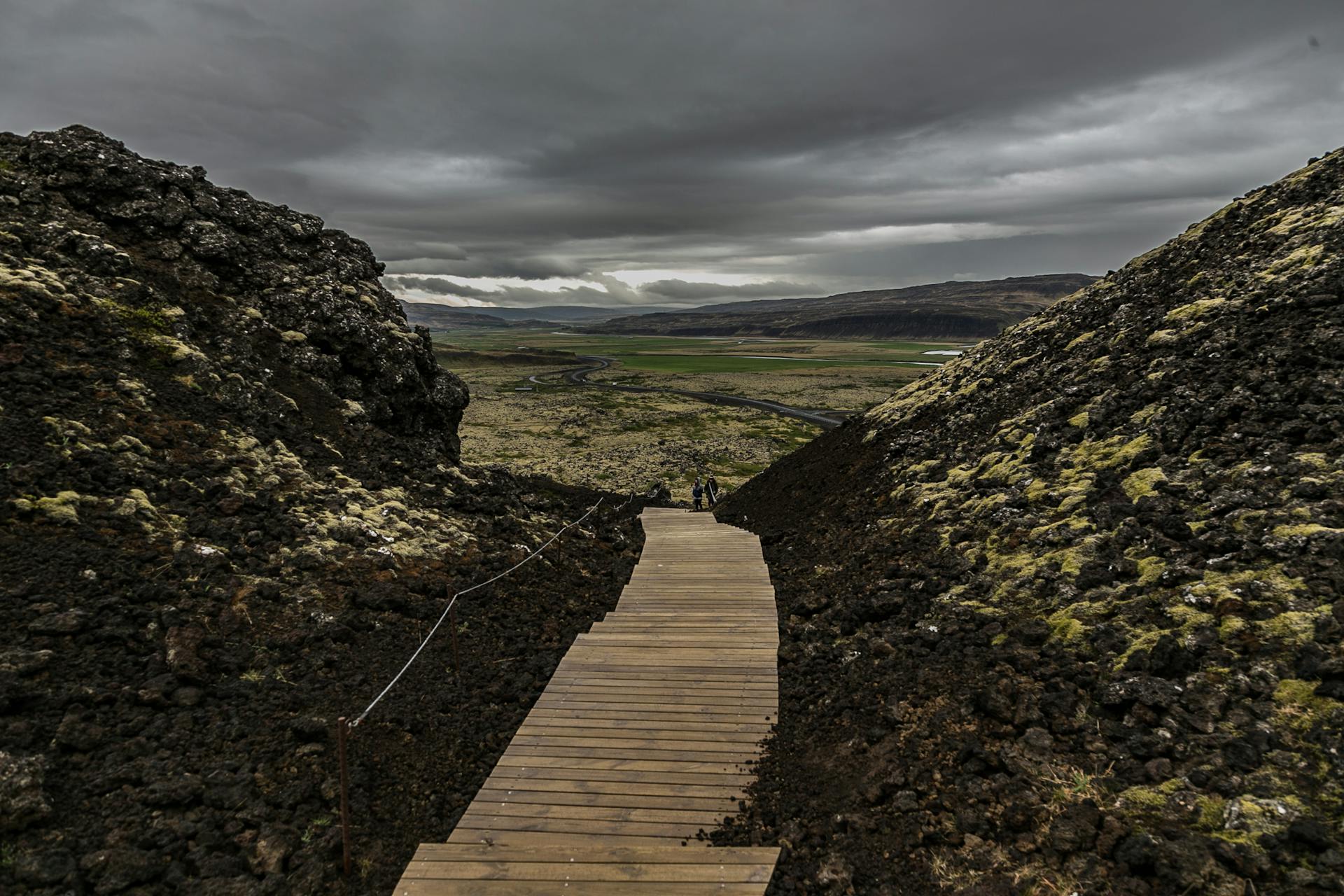 Snorkeller floating in the crystal-clear blue water of the Silfra fissure between two tectonic plates