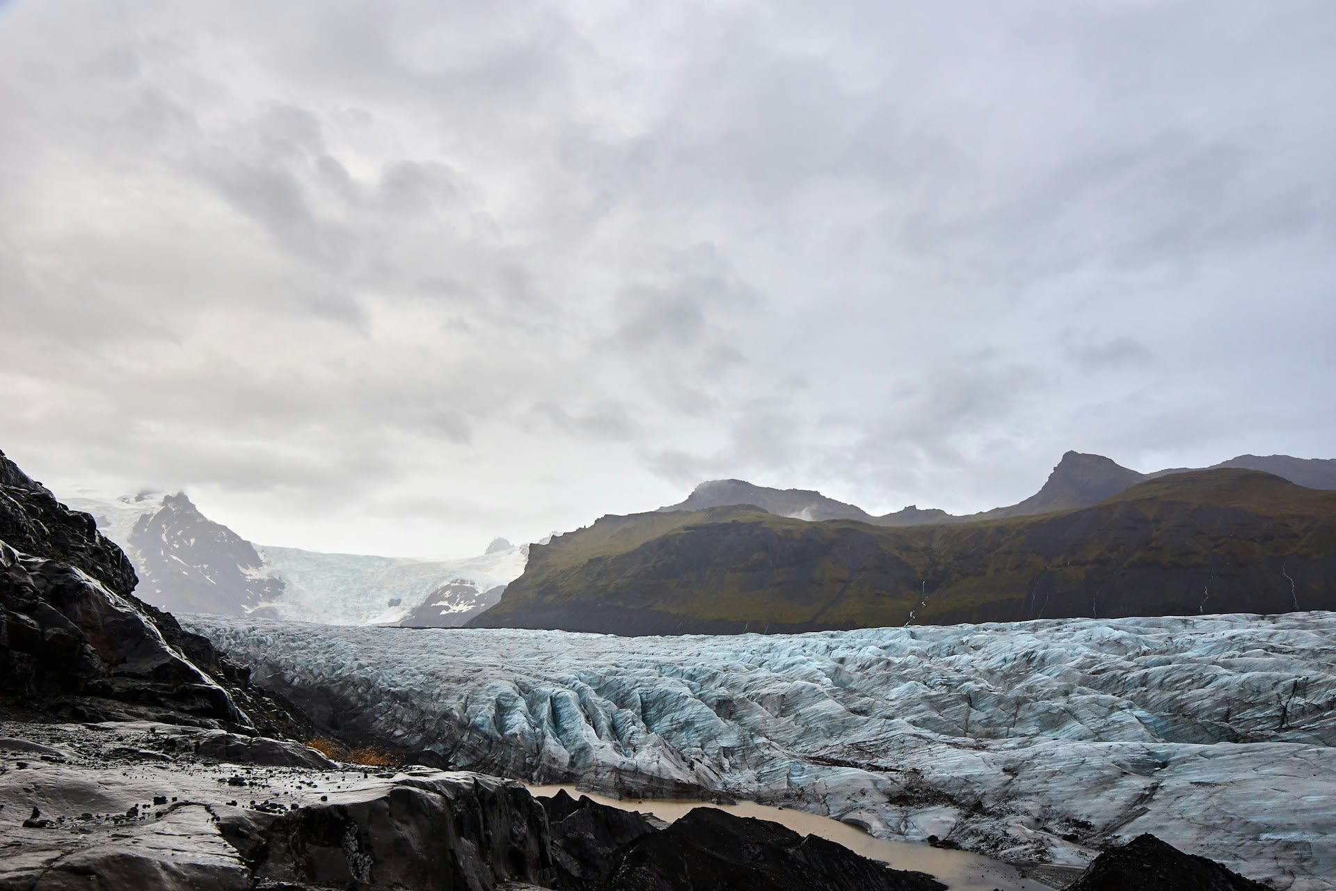 Fjaðrárgljúfur canyon carved by glacial floods with mossy walls and the clear river below southeast Iceland