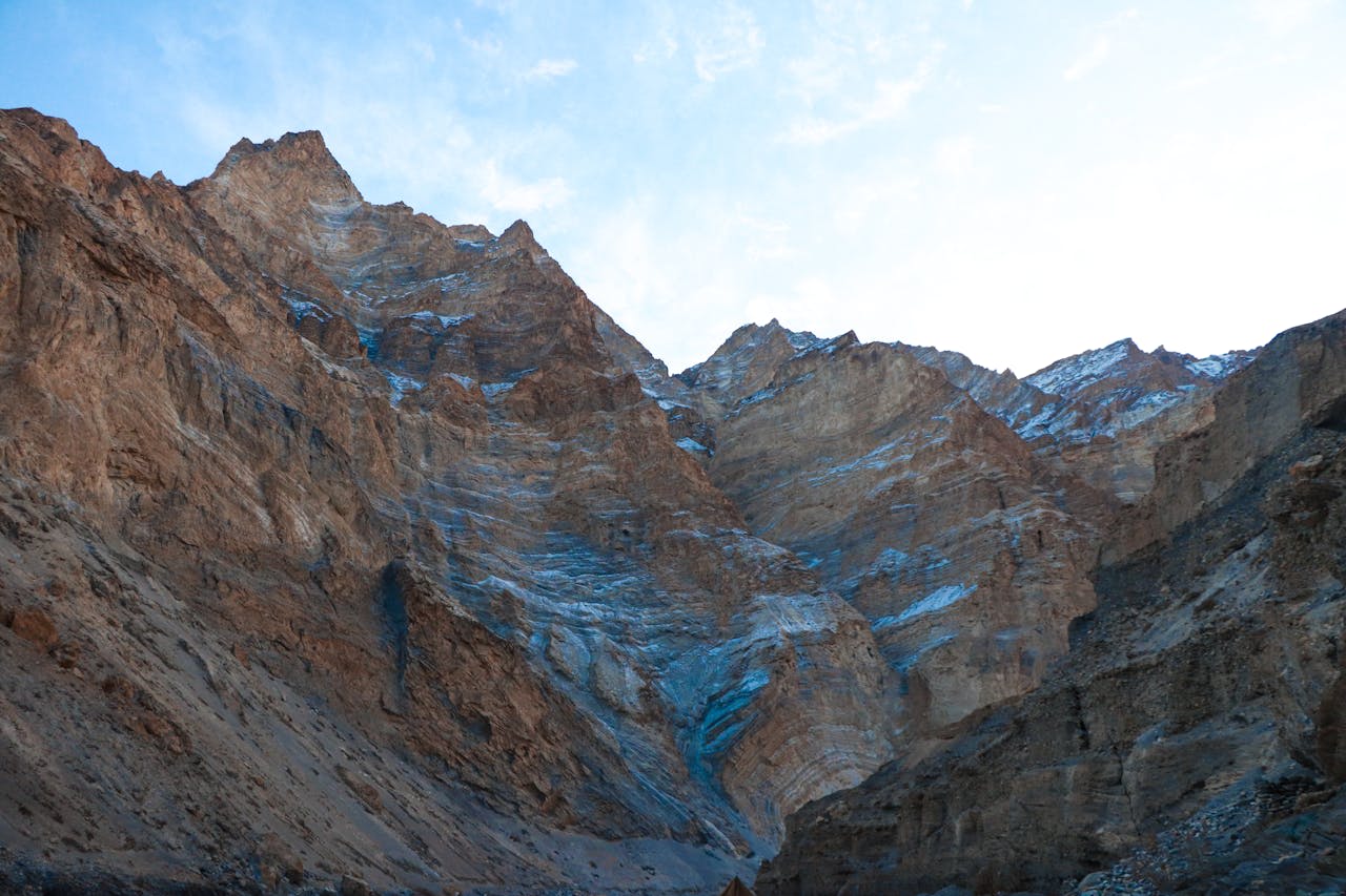 Nubra Valley sand dunes with Bactrian camels and the Karakoram Range behind in Ladakh India