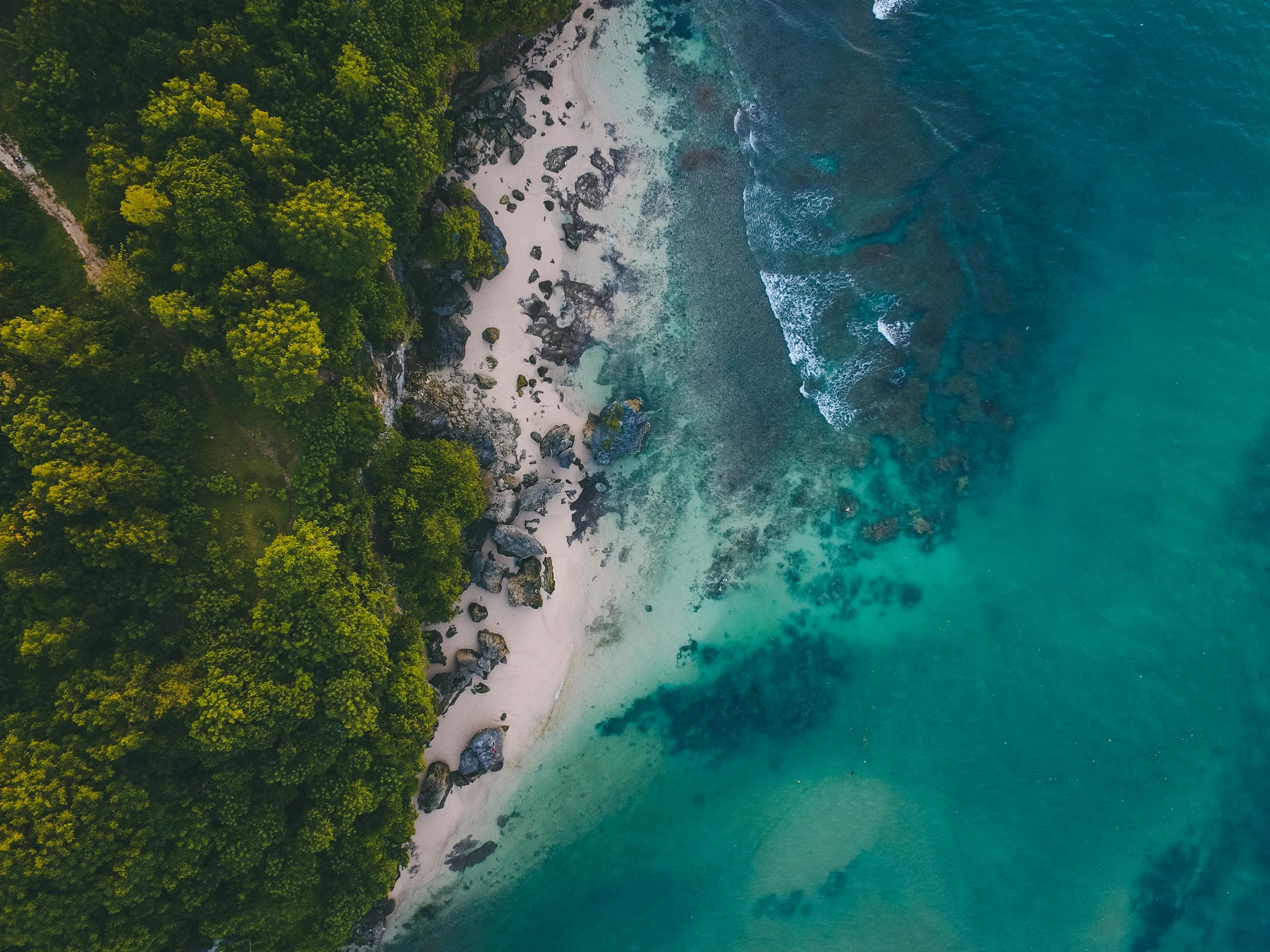 Torrential stream in Bali surrounded by water and a boat, Bali