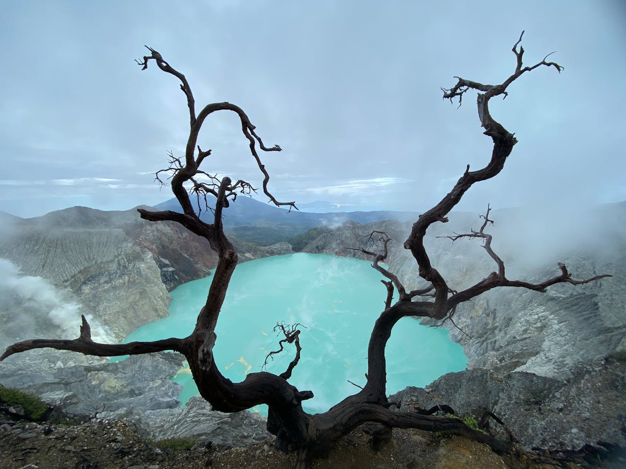 Electric blue sulfuric flames burning at night inside the Kawah Ijen crater in East Java Indonesia