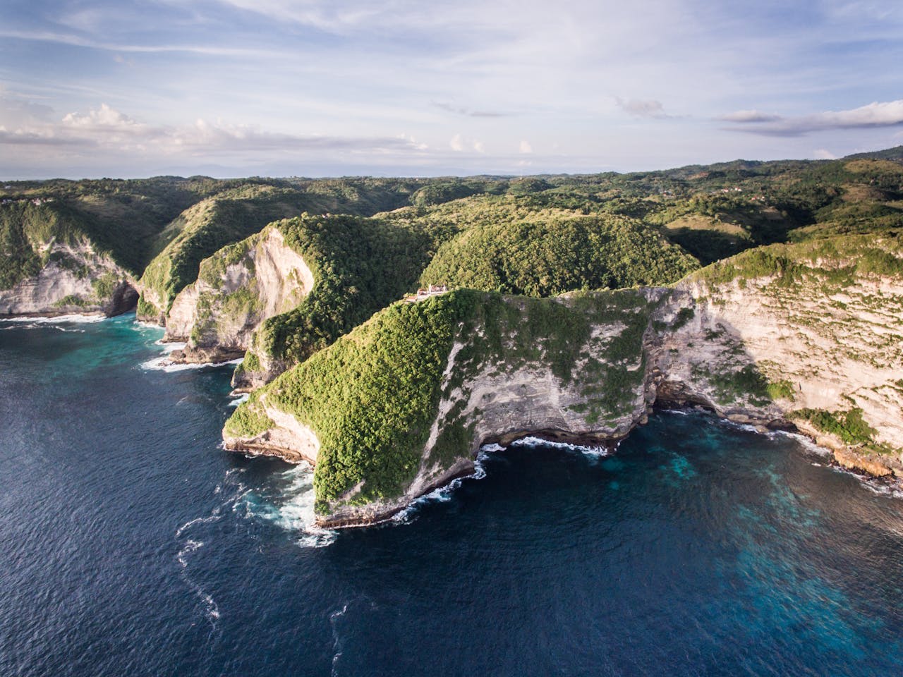 Kelingking Beach dramatic T-Rex shaped limestone cliff on Nusa Penida island Indonesia with turquoise water