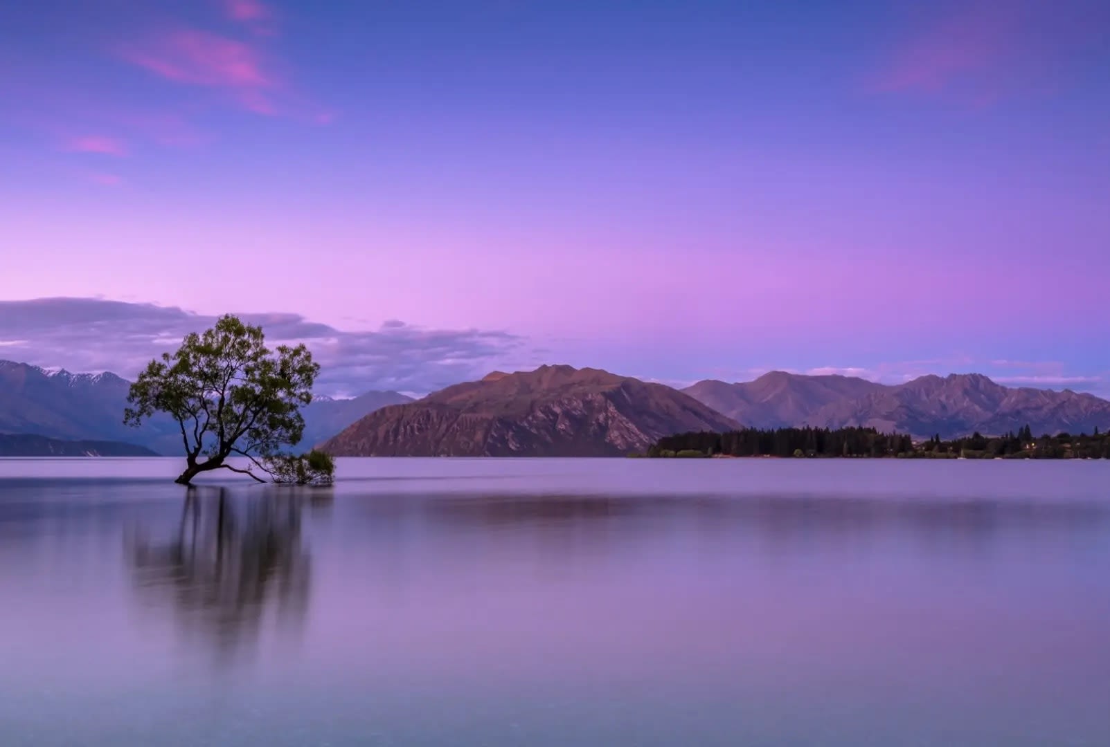 sunset over a lake with hills and mountains in the background, Lake Biwa