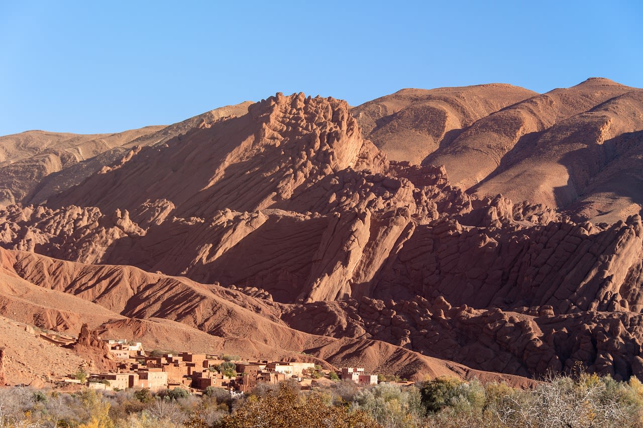 Dadès Gorge with red and orange sandstone cliffs and the winding river road in southern Morocco High Atlas