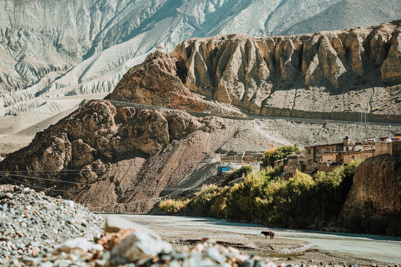 Ancient cave city carved into the ochre cliffs of the Kali Gandaki gorge in Mustang Nepal