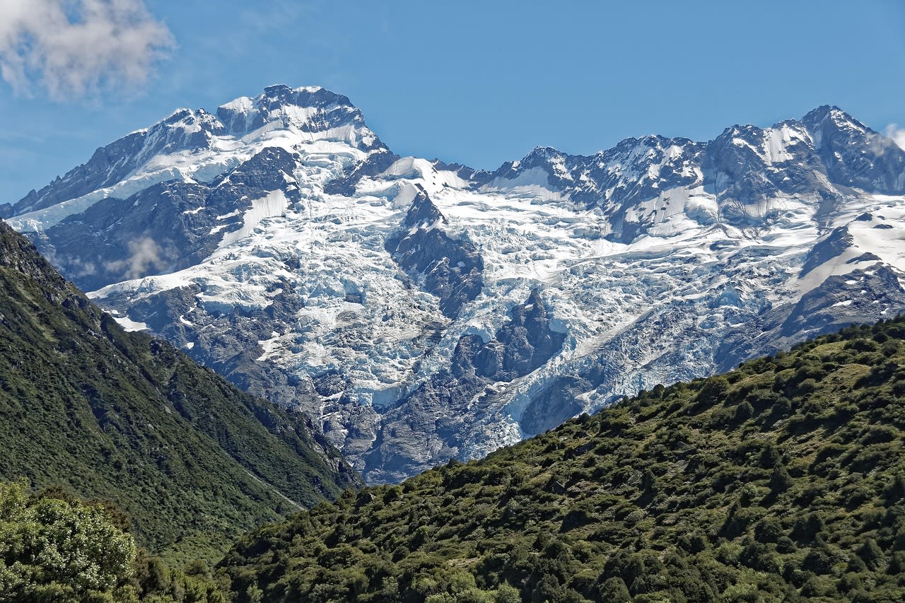 Snow-covered Mount Cook towering over a scenic valley