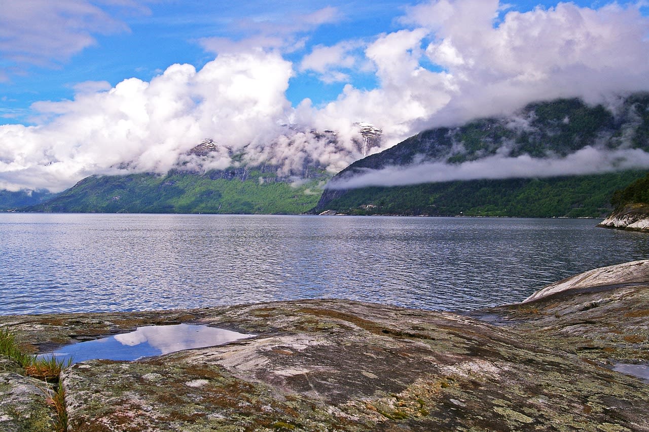 Trolltunga rock formation jutting horizontally over the Ringedalsvatnet lake 700 m below in Hardanger Norway