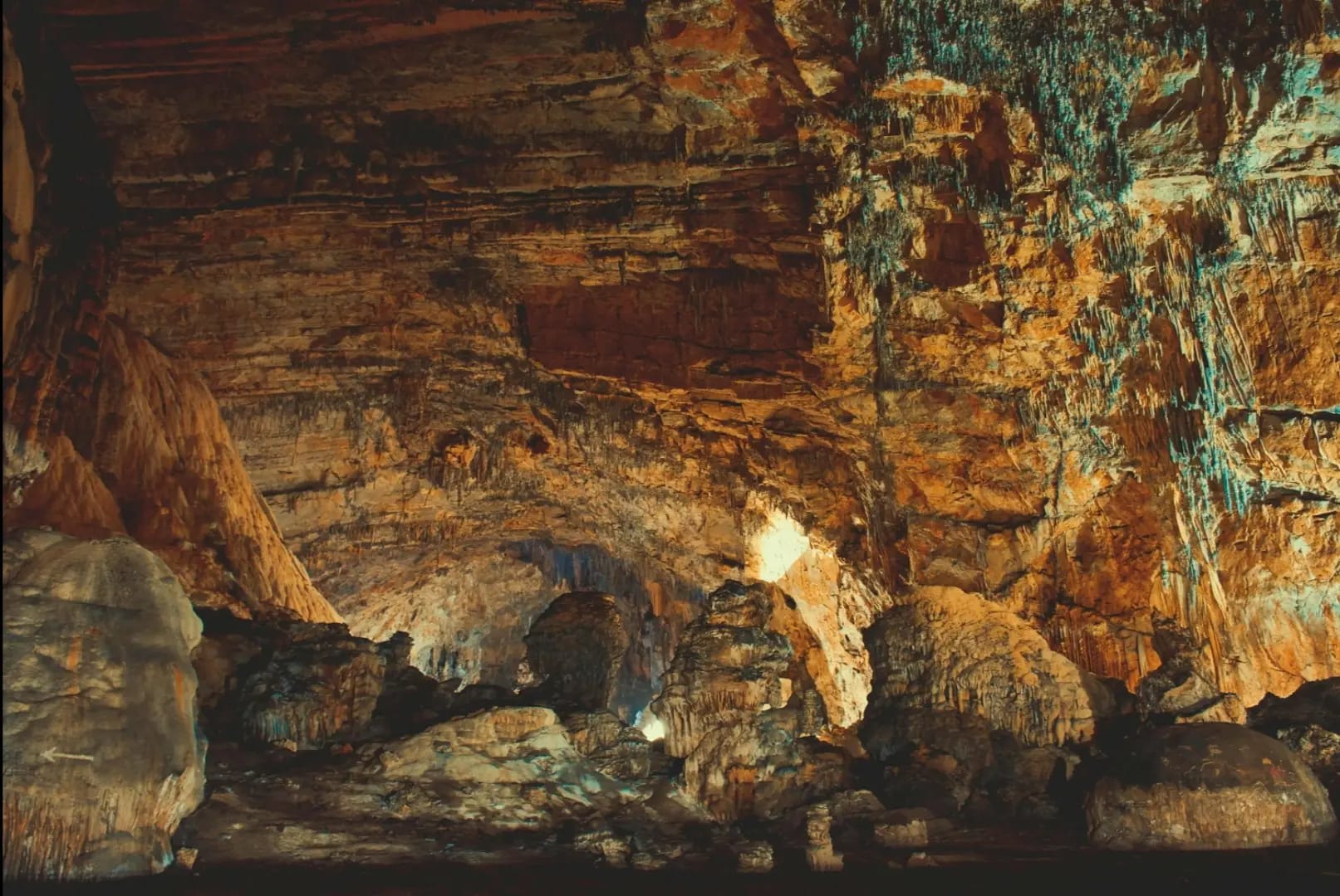 View of a smoother, geometric wall inside Cueva Ventana, displaying subtle patterns and shapes formed by natural processes, creating an intriguing contrast to the cave's more rugged features.