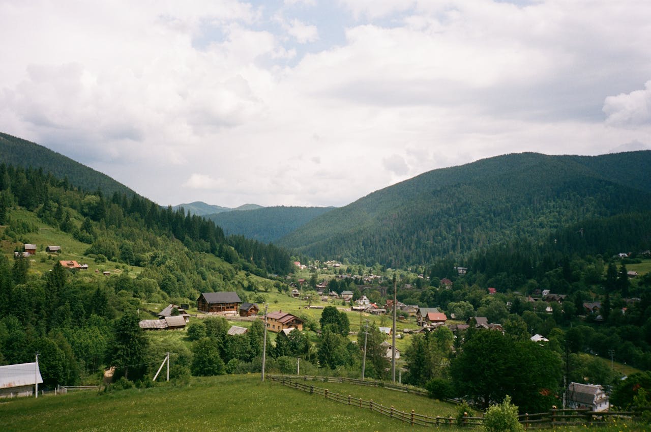 Snow-capped Fagaras Mountains and forested valleys of the Romanian Carpathians