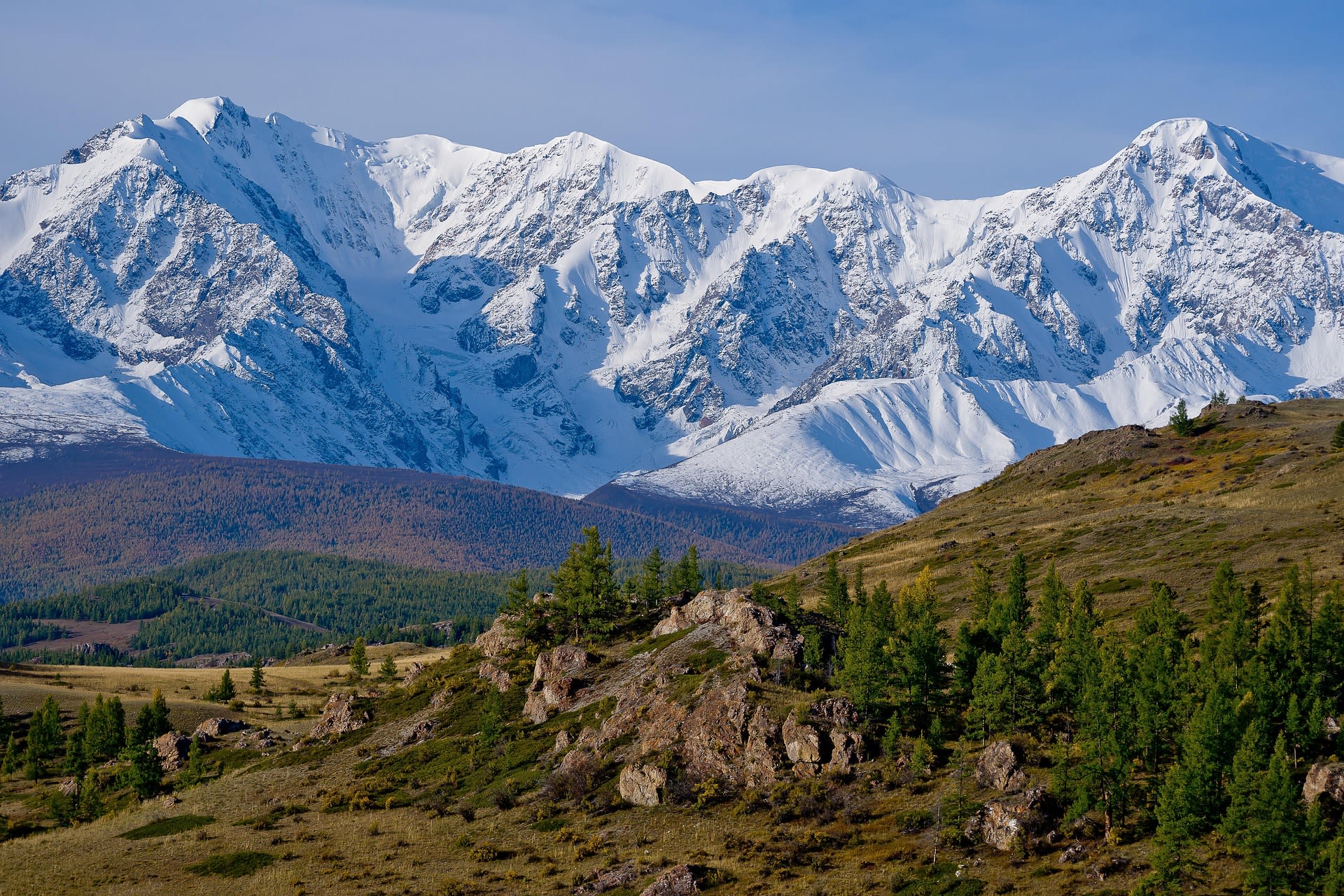 Lush green valleys and snow-capped peaks of the Altai Mountains, Russia