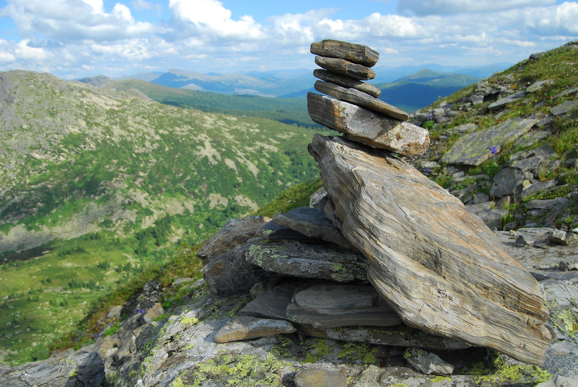 Starry night sky over the rocky silhouette of Ergaki peaks in Krasnoyarsk Krai, Russia
