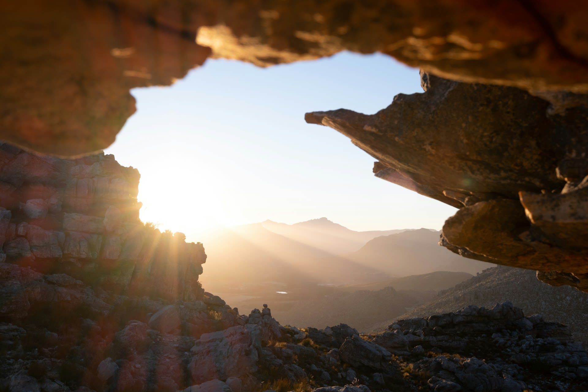 Cederberg landscape at sunset with red sandstone peaks, fynbos, and the Olifants River valley below