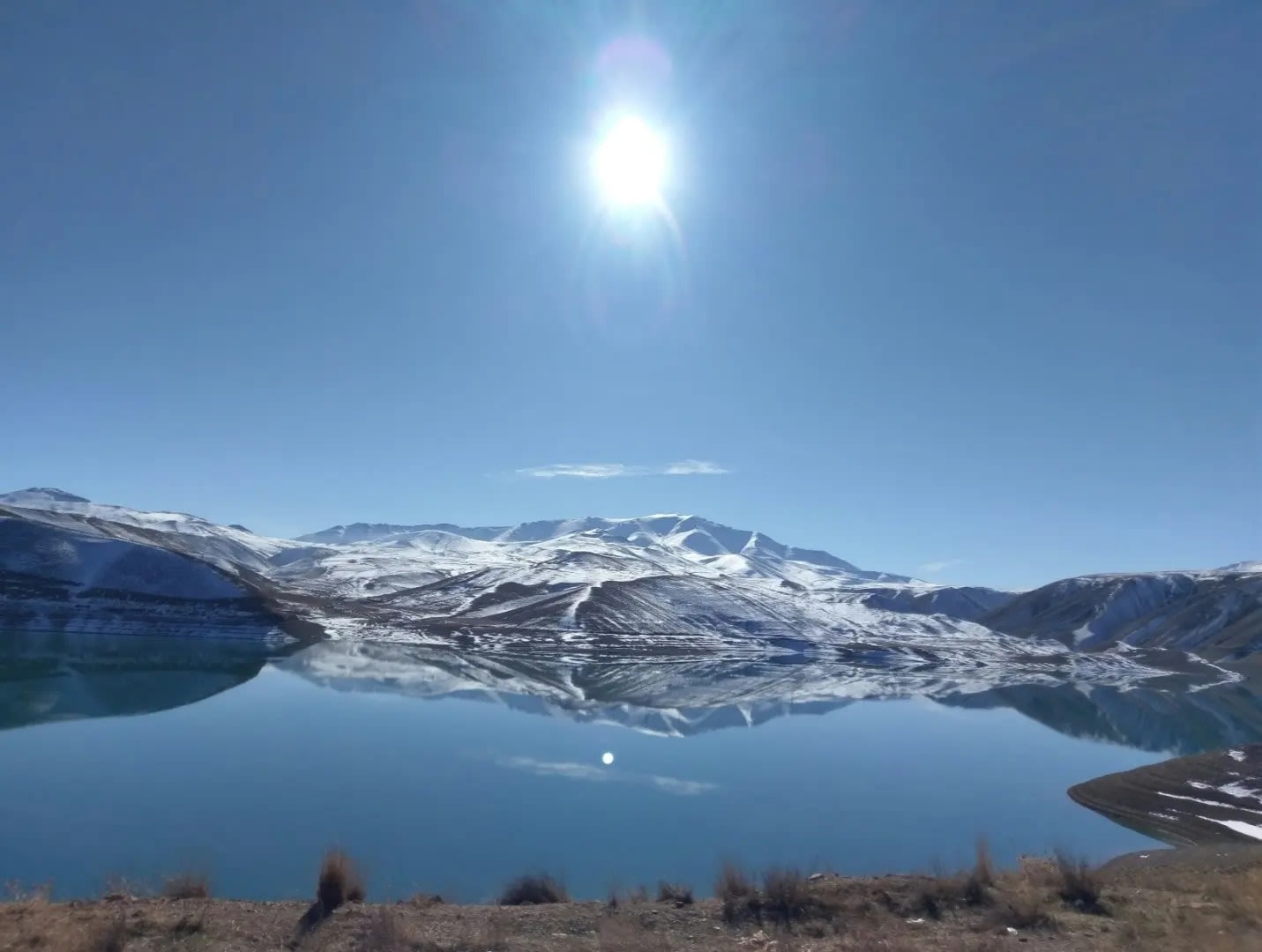 large lake with snowy mountains in the background and sunshine, Van Golu