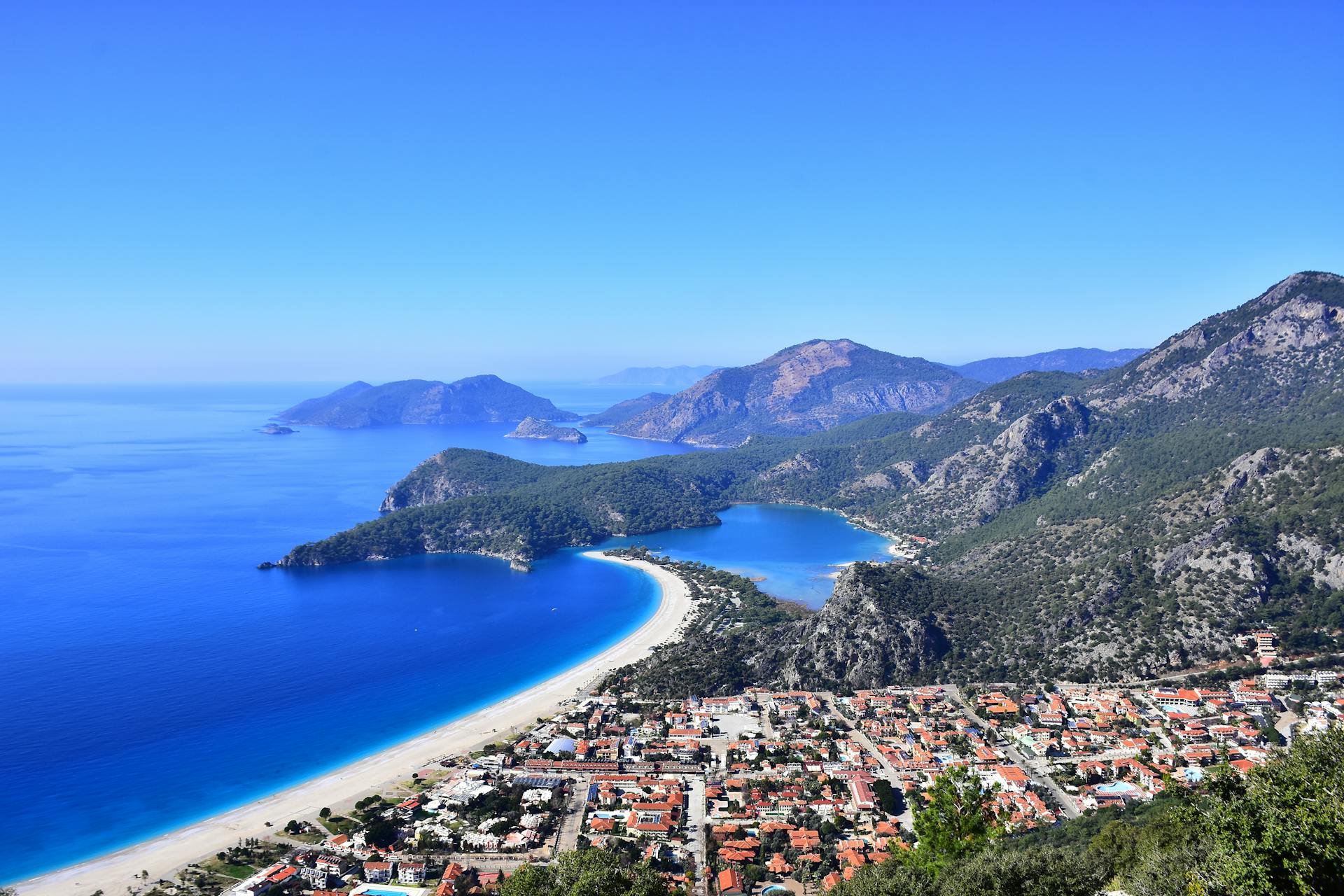 cape in mountains with trees and vegetation, Oludeniz