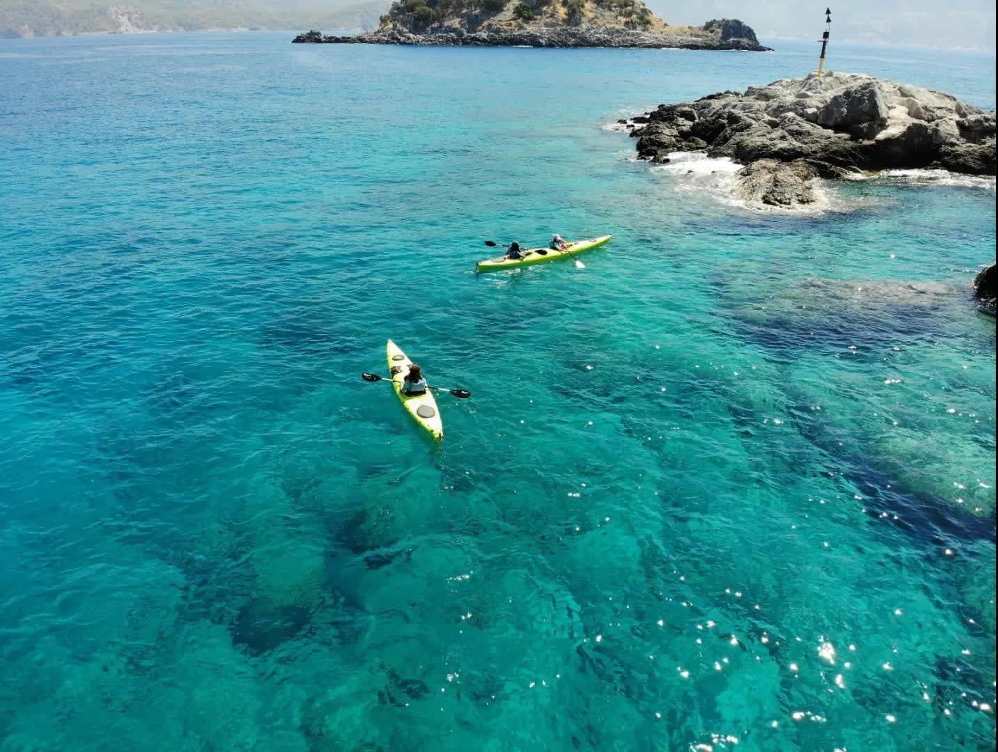 two kayaks in the sea with rocks, Oludeniz