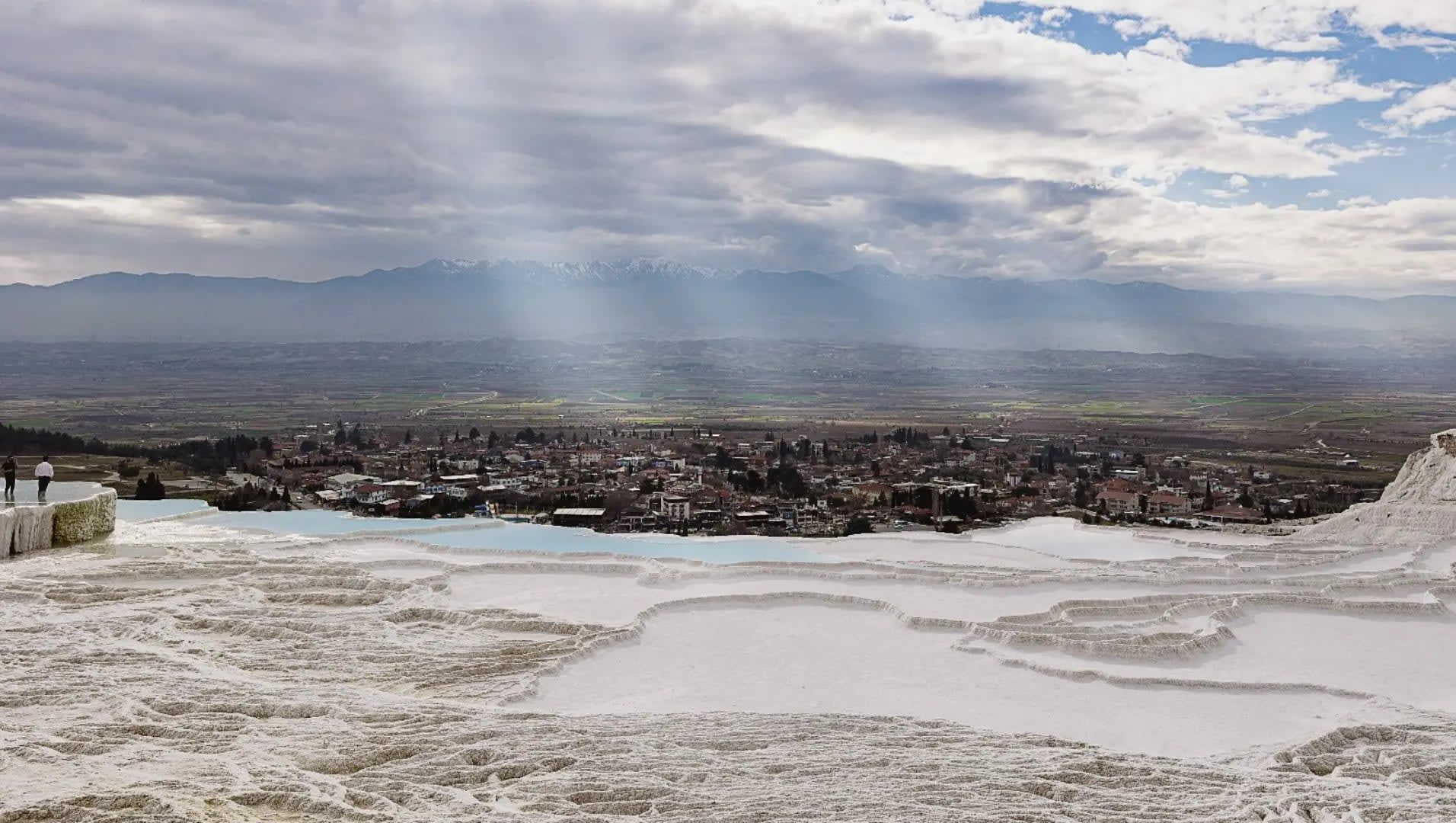 Pamukkale travertine terraces with thermal pools and ancient ruins, Pamukkale