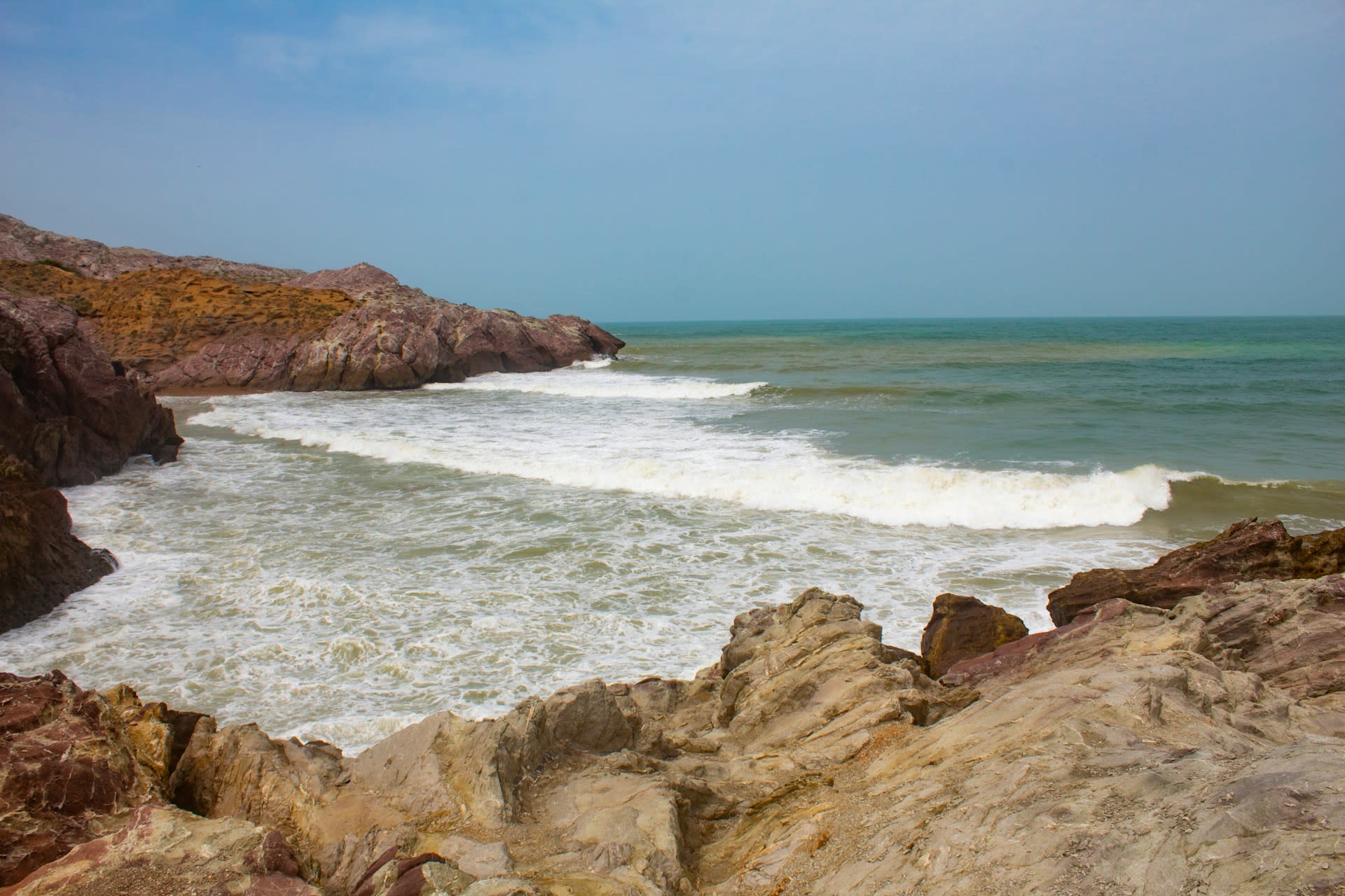 Rugged Arabian Sea coastline with rocky outcrops and open sky in Balochistan, Pakistan
