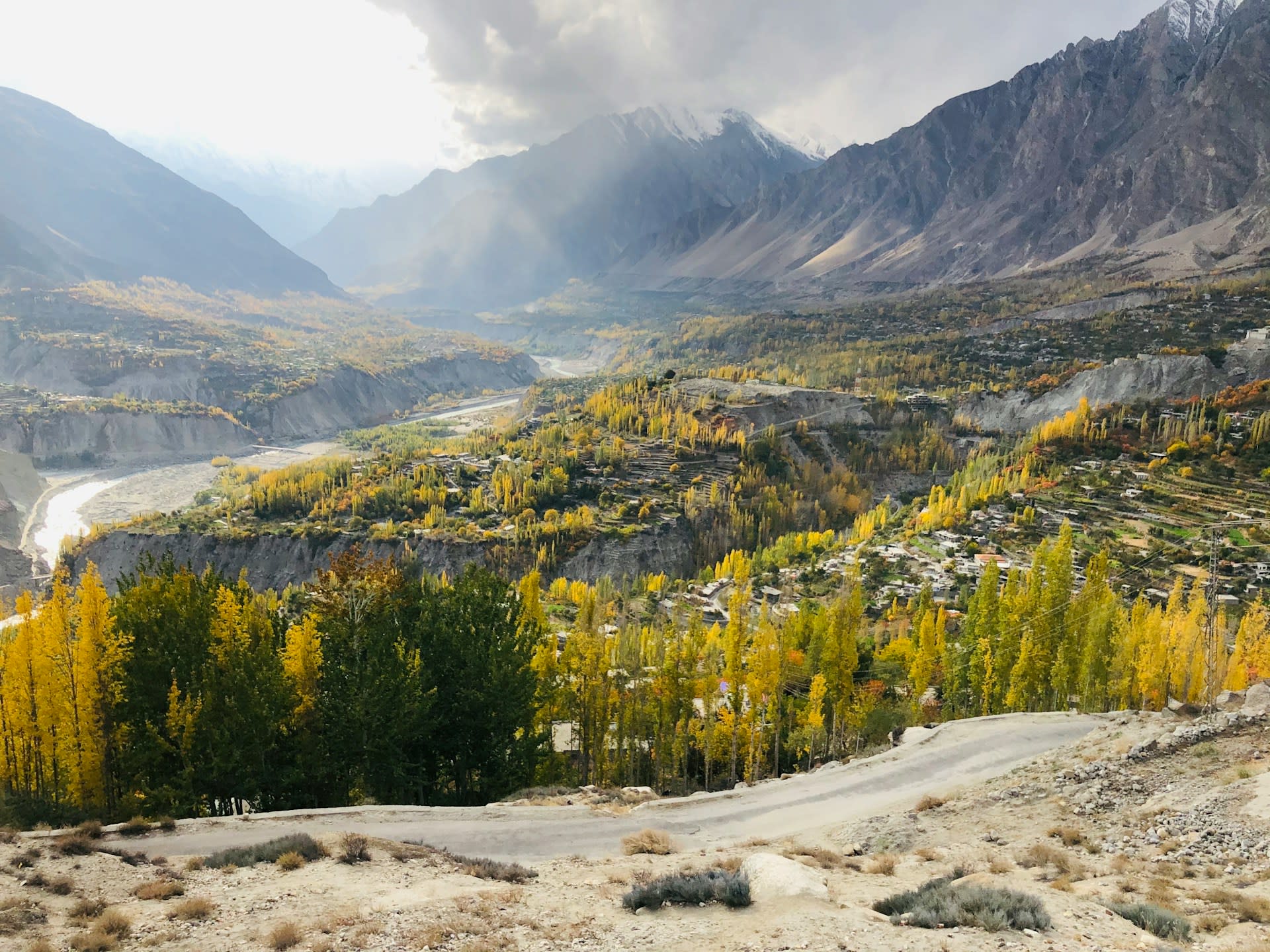 Blooming apricot orchards in spring with Rakaposhi peak in the background, Hunza Valley Pakistan