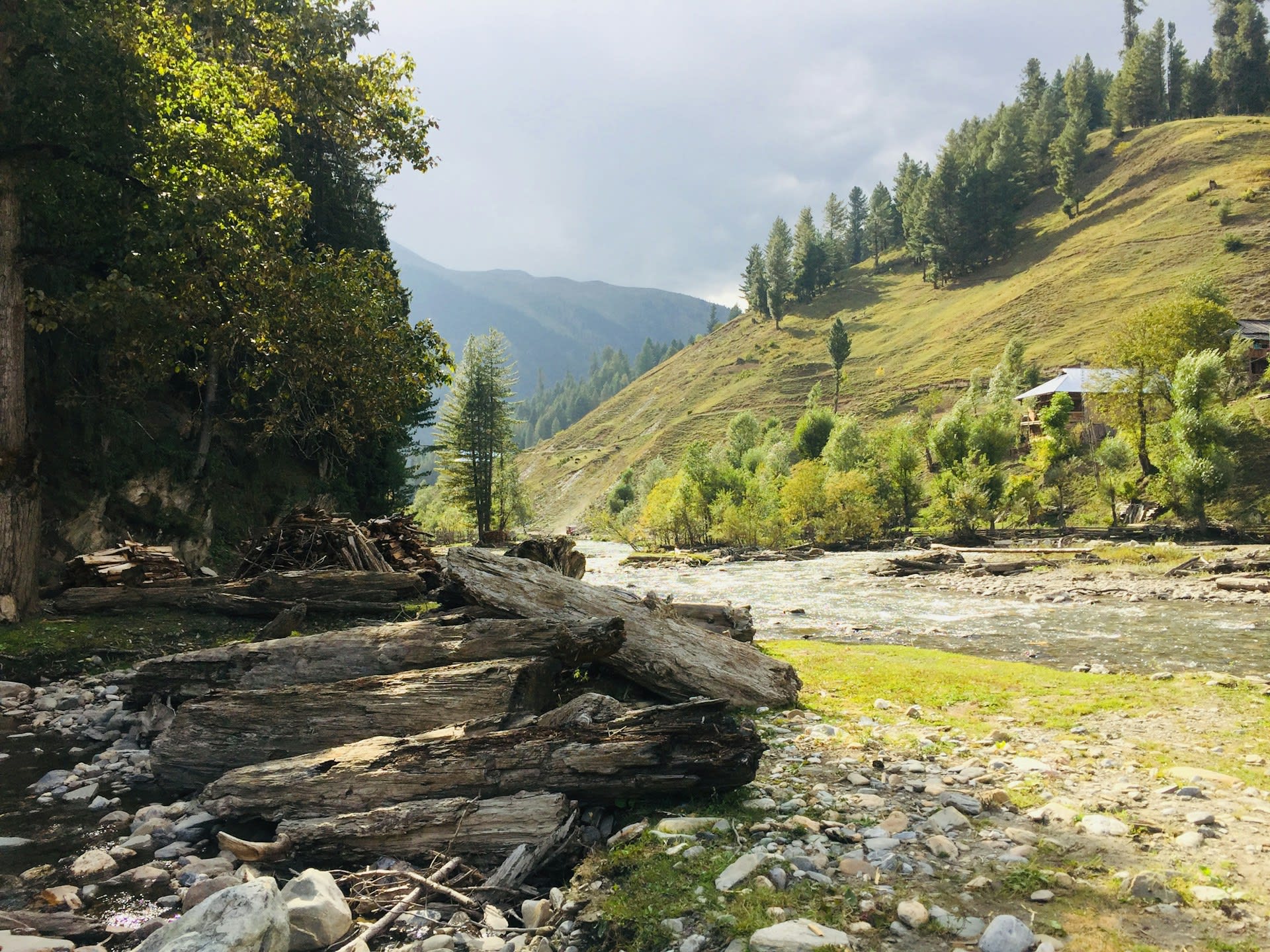 Snow-capped peaks and forested ridges of the upper Neelum Valley in winter, Pakistan