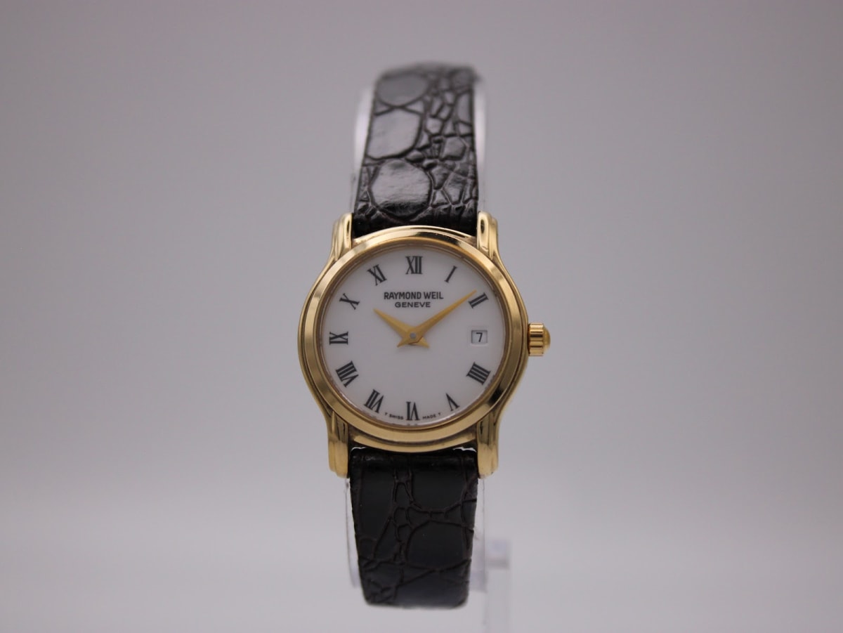 Front view of Raymond Weil 5360 watch with gold case, white dial, roman numerals, and black leather strap.