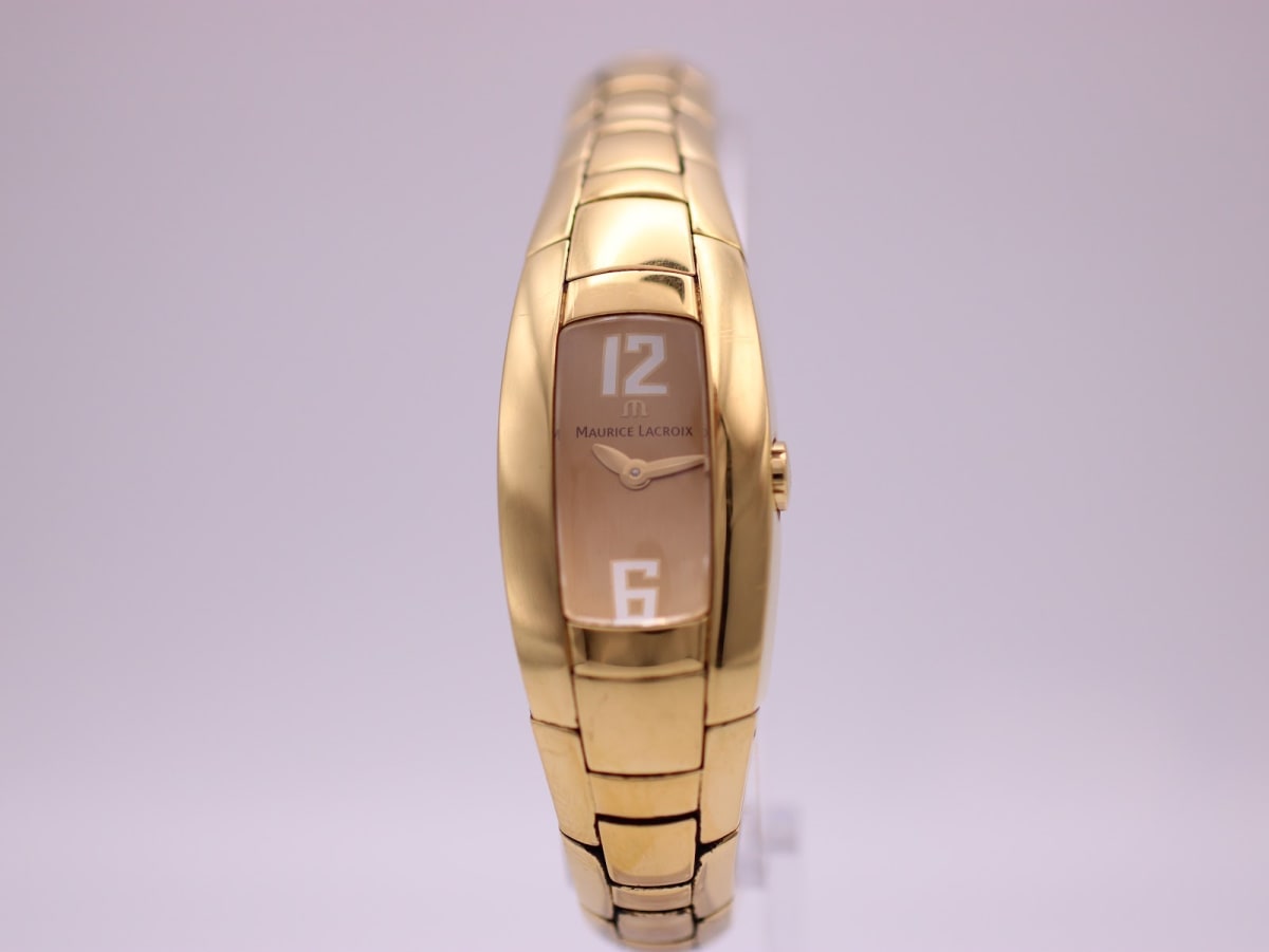 Front view of the Maurice Lacroix IN3012 gold-plated watch, showing its tonneau case and brown dial with '12' and '6' numerals.