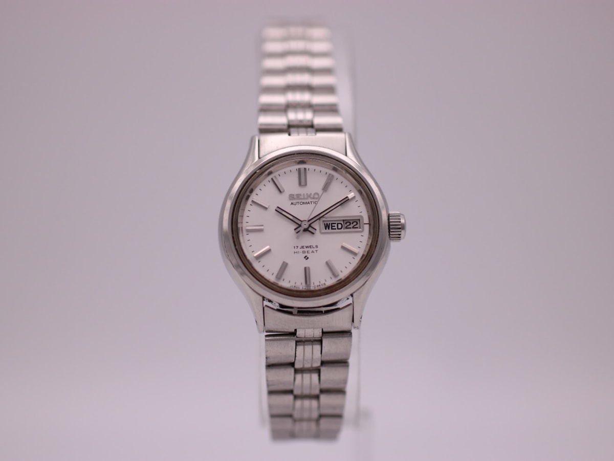 Front view of the SEIKO 2906-0020 ladies' automatic watch with a white dial, day-date complication, and stainless steel bracelet.