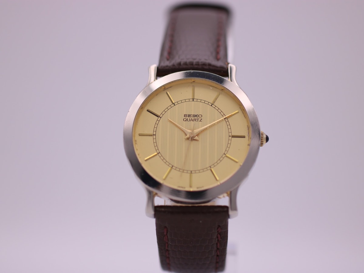 Seiko V701-0070 watch with champagne dial and two-tone case, circa 1991