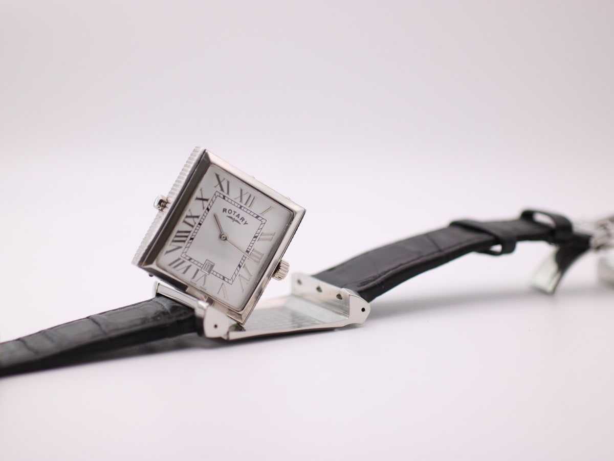 Close-up of Rotary Revelation black dial side rotated, with case back in background.