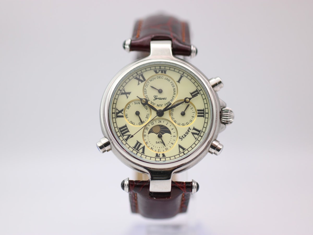 Front view of Stauer Graves 13372 multi-complication watch with cream dial and brown leather strap.