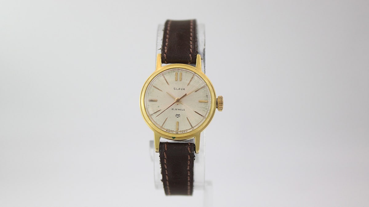 Front view of the Slava gold-tone ladies watch with cream sunburst dial and brown leather strap.
