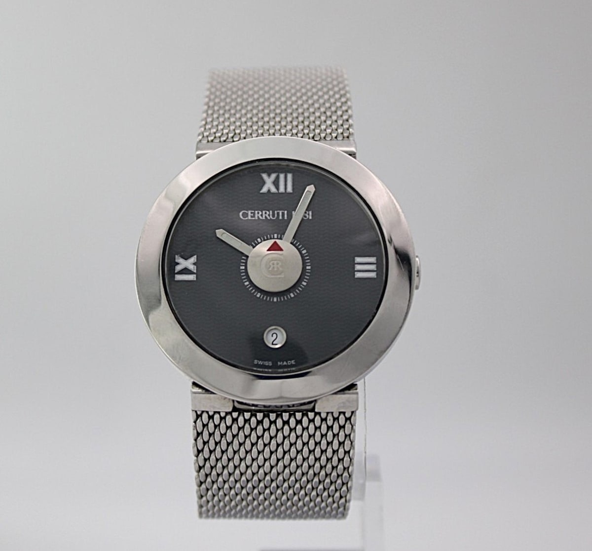 Front view of Cerruti 1881 watch with black dial and silver mesh bracelet.
